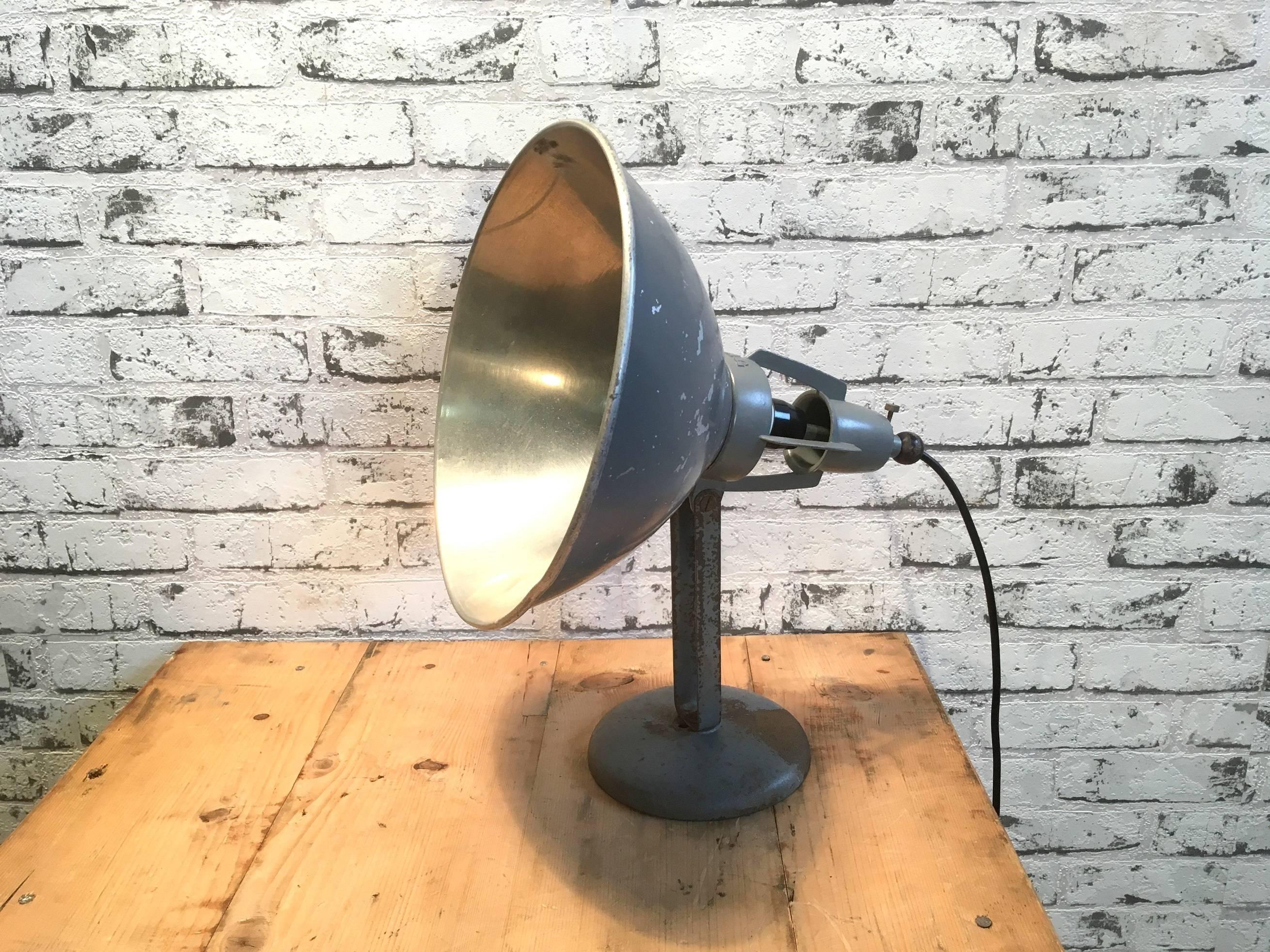Industrial table lamp manufactured in the 1930s in Switzerland by BAG Turgi. The lamp is made from a steel base and adjustable aluminium shade.
New porcelain socket for E 27 lightbulbs. New wire. The diameter of the shade is 28 cm.

 