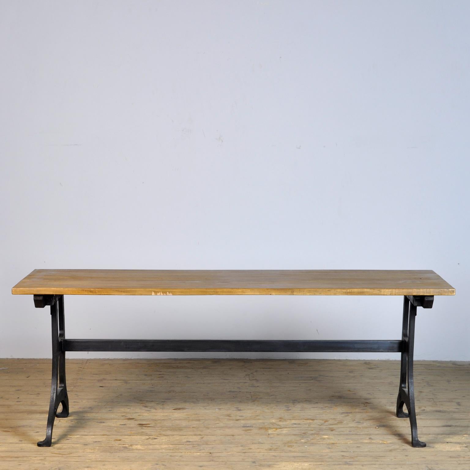 The table is made from an old industrial cast iron machine base and a wooden top. Big enough to seat 6 people.
 