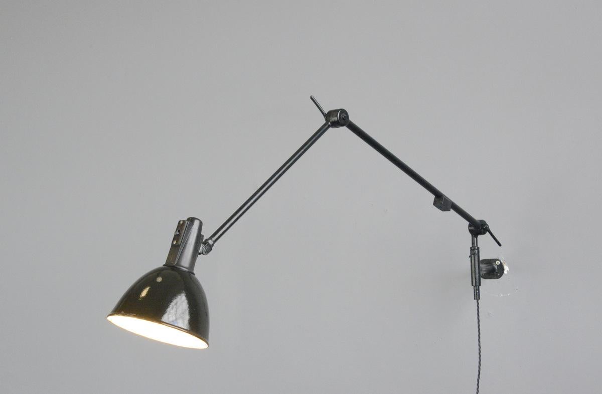 Industrial task lamp by Willhelm Bader, circa 1930s

- Black enamel shade
- Original Bakelite head with on-off switch
- Articulated arms
- Takes E27 fitting bulbs
- By Willhelm Bader
- German, 1930s
- Measures: 17 cm wide
- Extends up to
