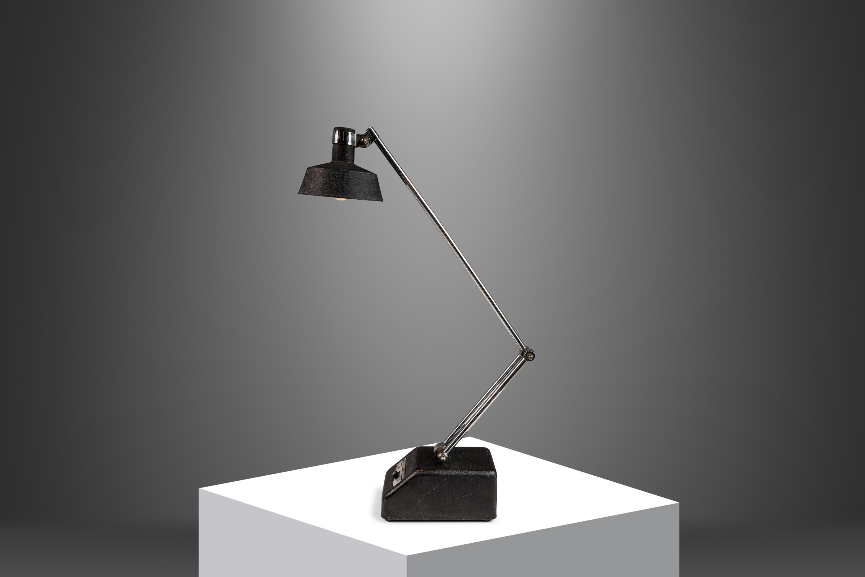 Tensor adjustable desk or table lamp with perfect 1970's styling is small in size but great for tight space for its small footprint. Enameled base and shade, chrome stem, with adjustable height and angle. Works perfectly and in excellent vintage