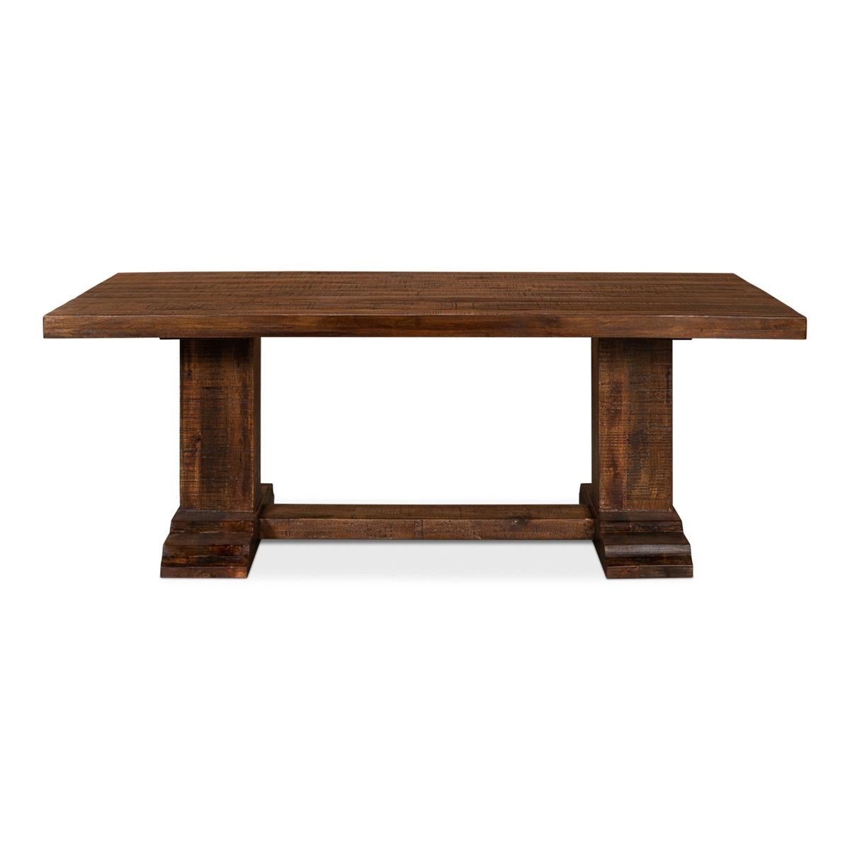 Industrial trestle end dining table. A bold and rustic design with a wide range of characteristics makes this a classic table option. Featuring grand scale and the rough-hewn elements of artisanal craftsmanship, this table easily moves from formal