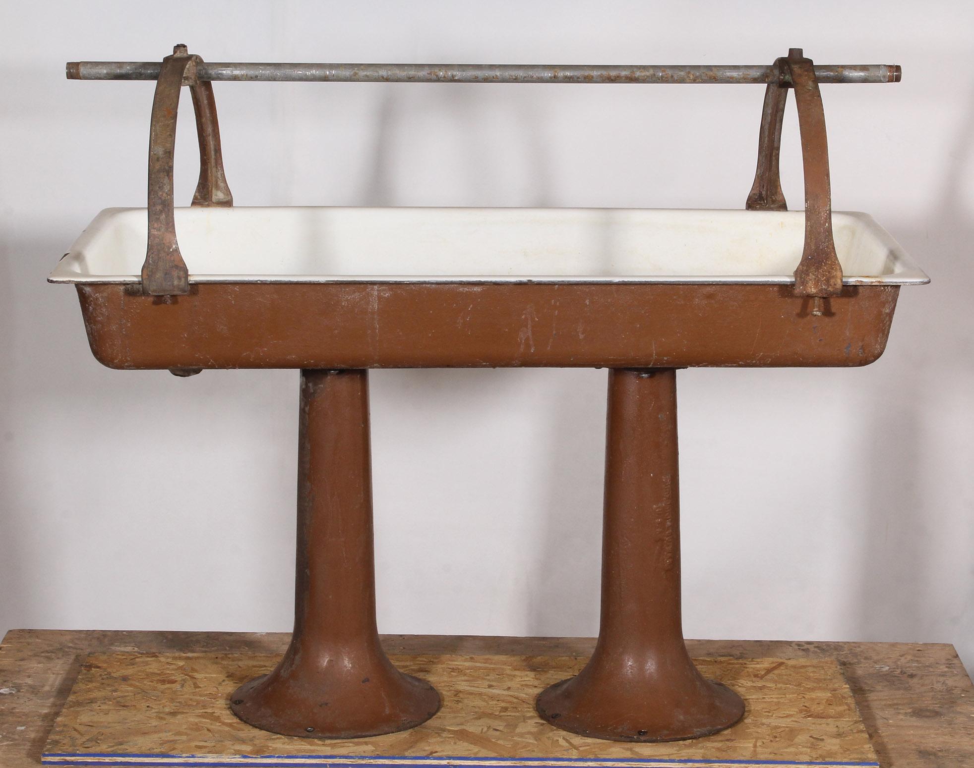Vintage industrial bathroom communal trough sink.