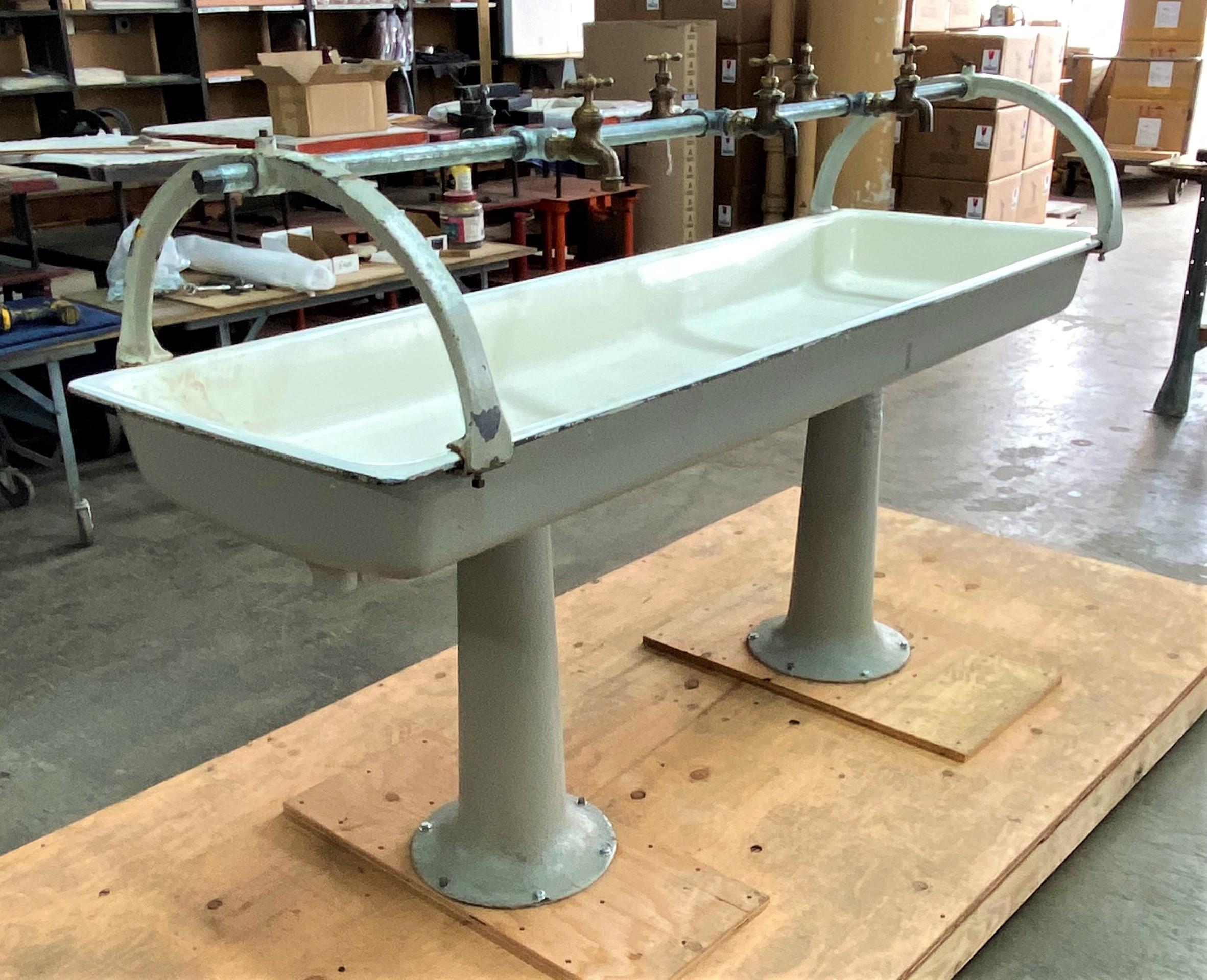 Vintage industrial double pedestal trough sink.

Overall dimensions: 24