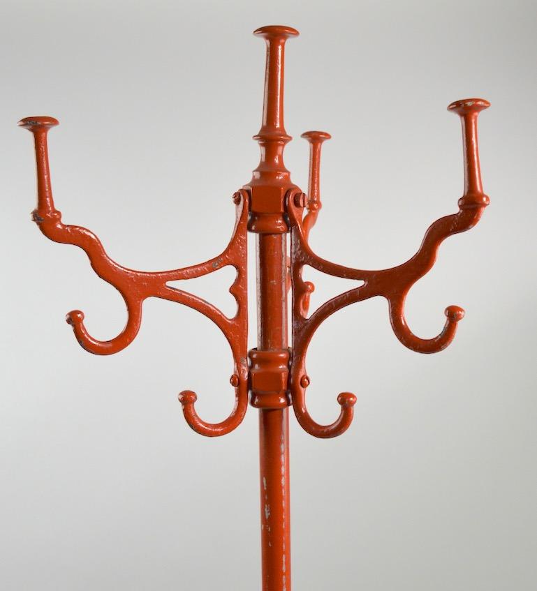 Nice Industrial style Victorian period cast iron coat tree stand - four revolving arms at top, each having three hooks for coats, hats scarves etc.
No breaks, welds, repairs or damage - Currently in later orange paint finish.