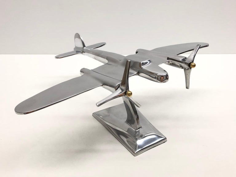 A Industrial plane model made in the 1980s. This unique object is made of metal, probably aluminum. A nice industrial sculpture for displaying them on a cupboard, credenza or a desk.