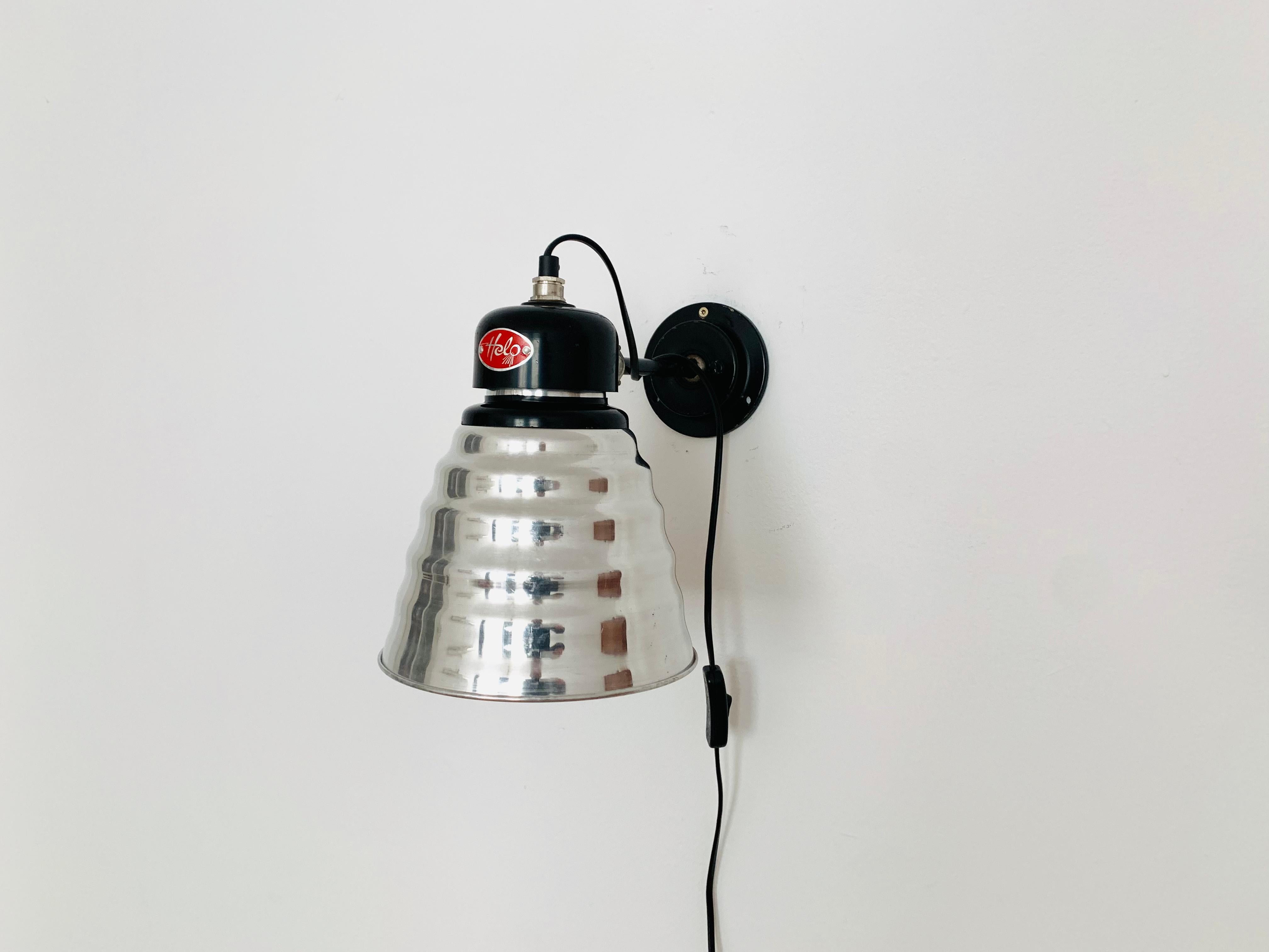 Very nice adjustable industrial wall lamp from the 1950s.
The lighting effect of the lamp is extremely beautiful because the lampshade creates a very nice effect.
Thanks to the ball joints, the lampshade and the arm can be flexibly