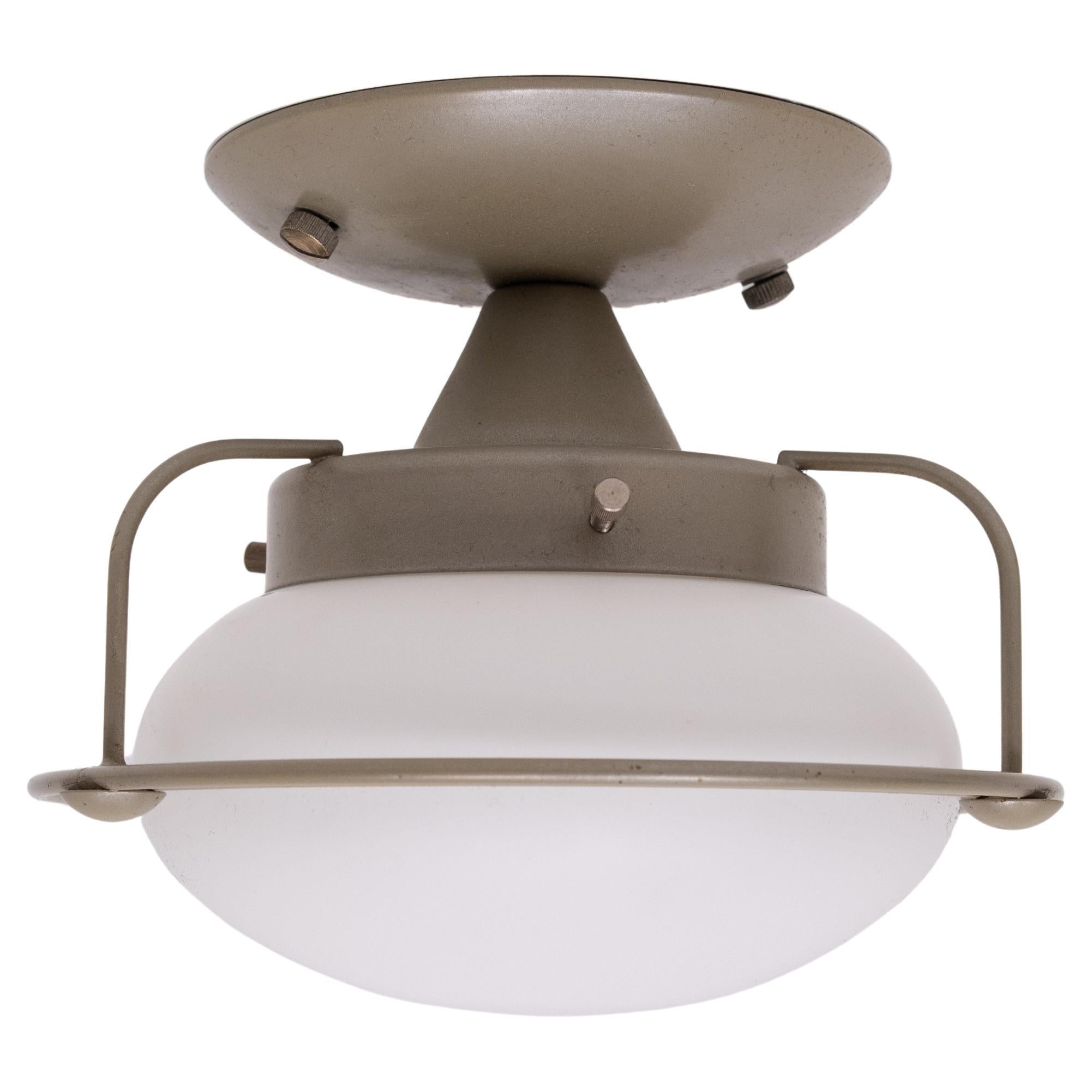 Very nice set of 4 Steinhauwer wall or ceiling lamps . 
Industrial Design . Metal frame ,comes with a Opaline Glass shade .
small socked bulbs needed . good condition . 