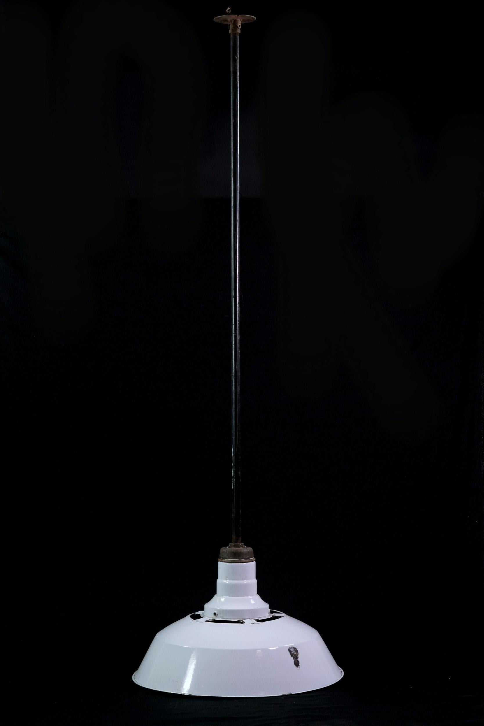 White enamel shade with black bottom trim mounted to a steel conduit pole. Some chipping and rust which varies by light. Small quantity available at time of posting. Cleaned and rewired. Priced each. Please inquire. Please note, this item is located