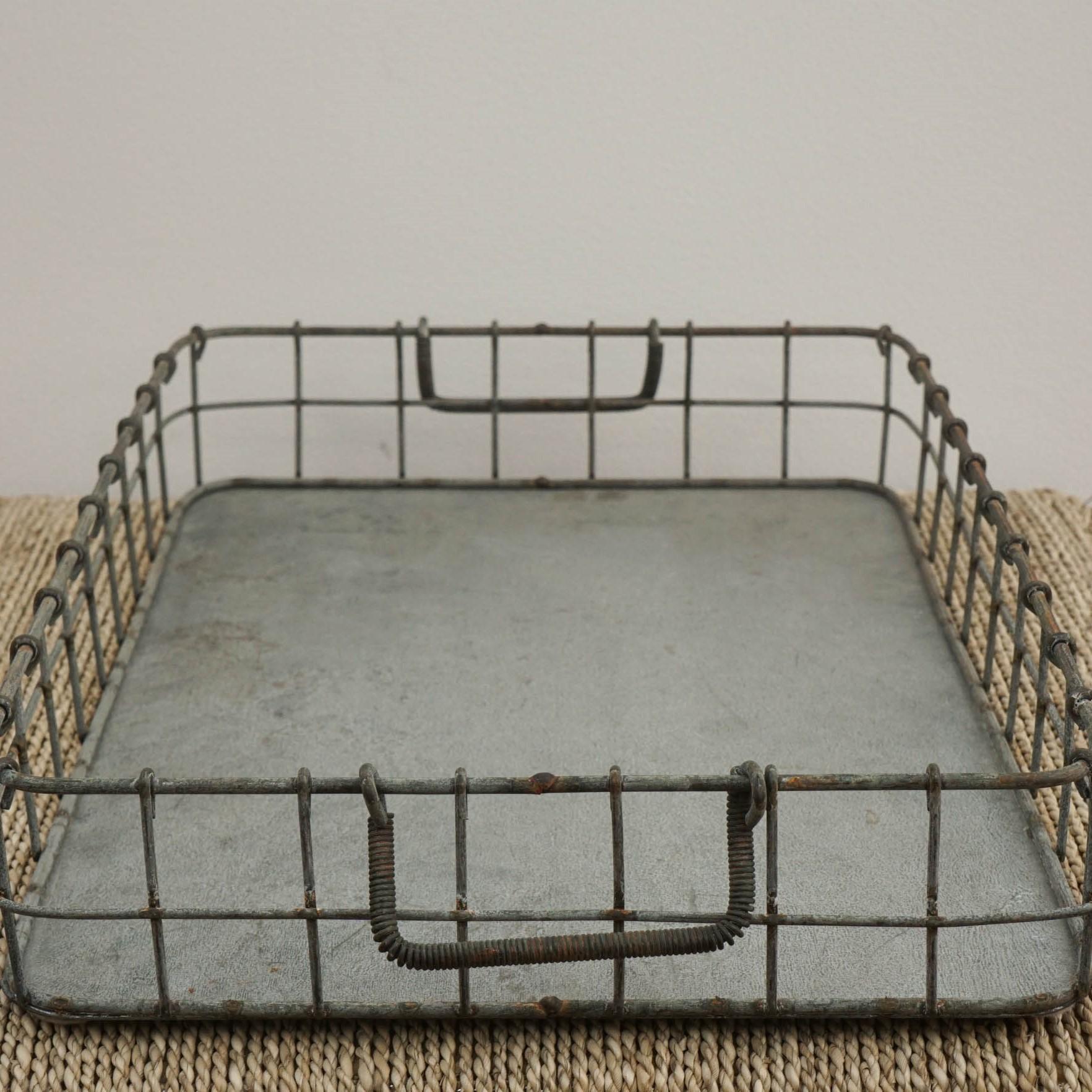 Industrial style vintage wire tray with handles and galvanized base. Perfect addition to a garden or patio table. 