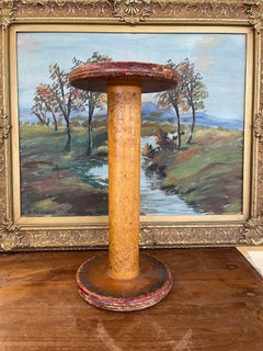 Industrial Wooden Textile Mill Bobbin or Spool with Red Painted Ends.