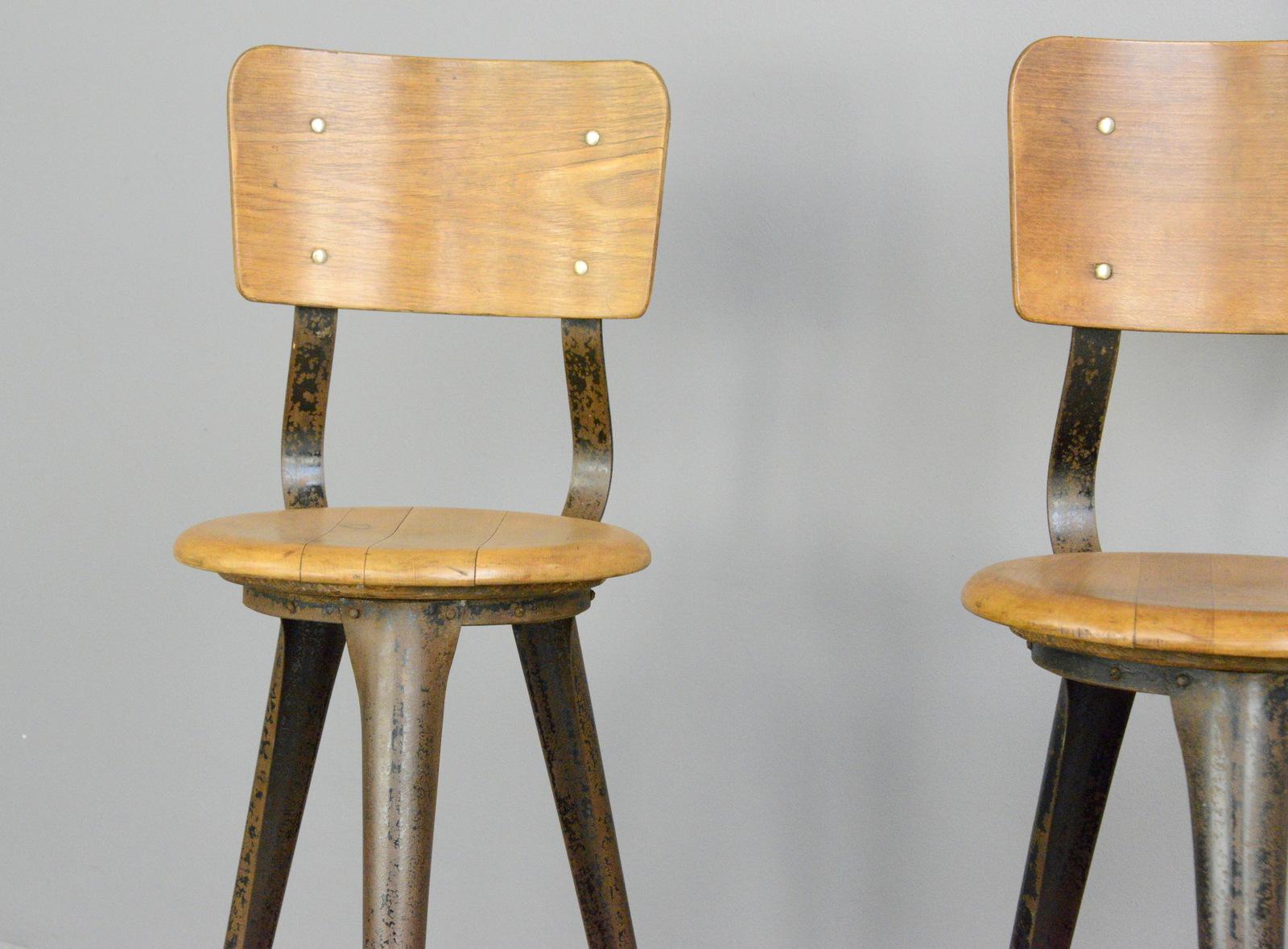 Industrial work stools by Ama, circa 1930s

- Price is per stool
- Steel frame
- Solid elm seat with ply backrest
- Designed by Albert Menger 
- Produced by Ama, Nordhalben
- German, 1930s
- Measures: 35cm wide x 41cm deep 
- 56cm seat