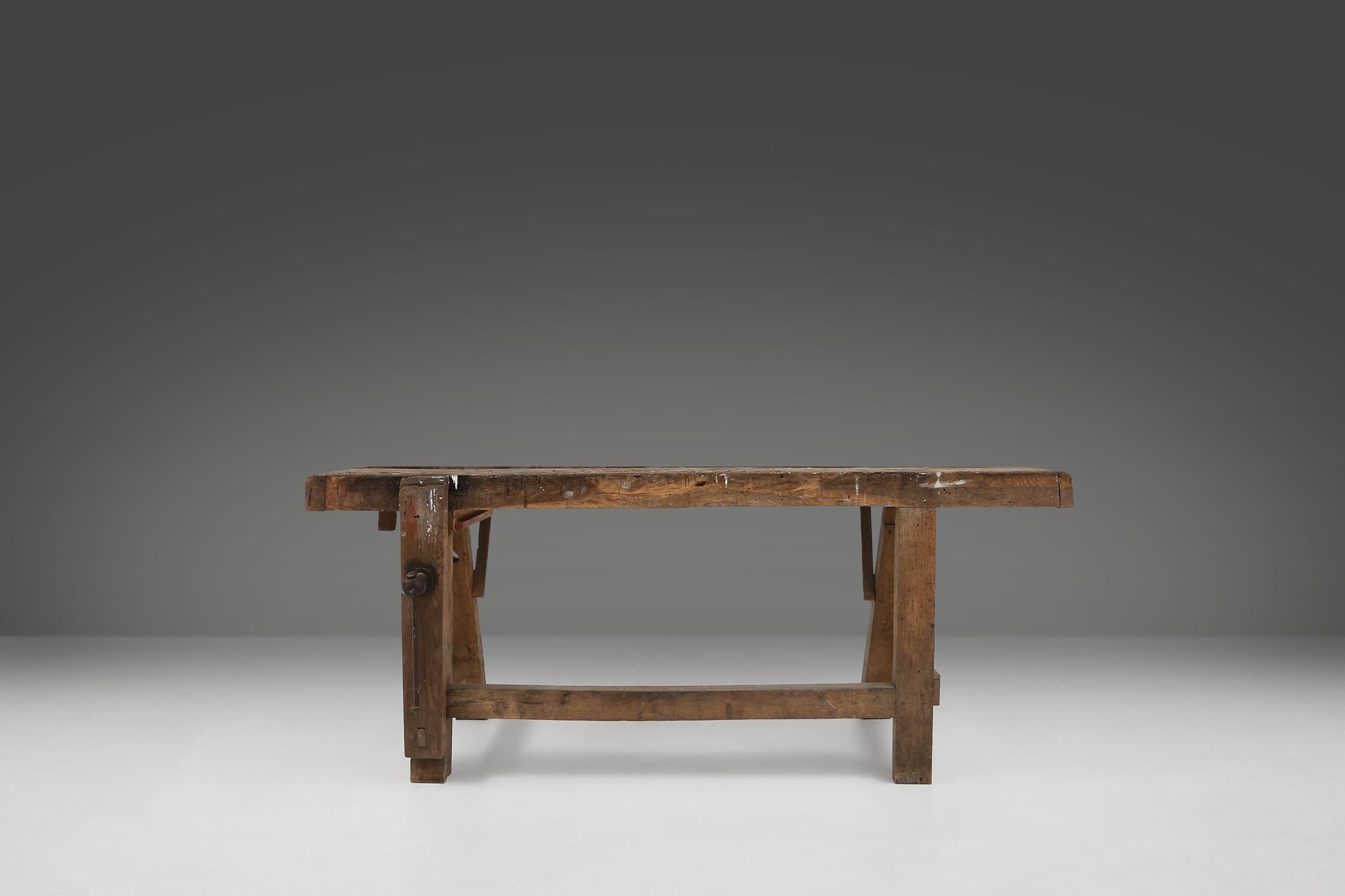 This beautiful old workbench is made of solid wood and has a beautiful patina on the wood. It is a unique piece that fits perfectly in any interior. The workbench is not only functional but also a real eye-catcher. This is a unique opportunity to
