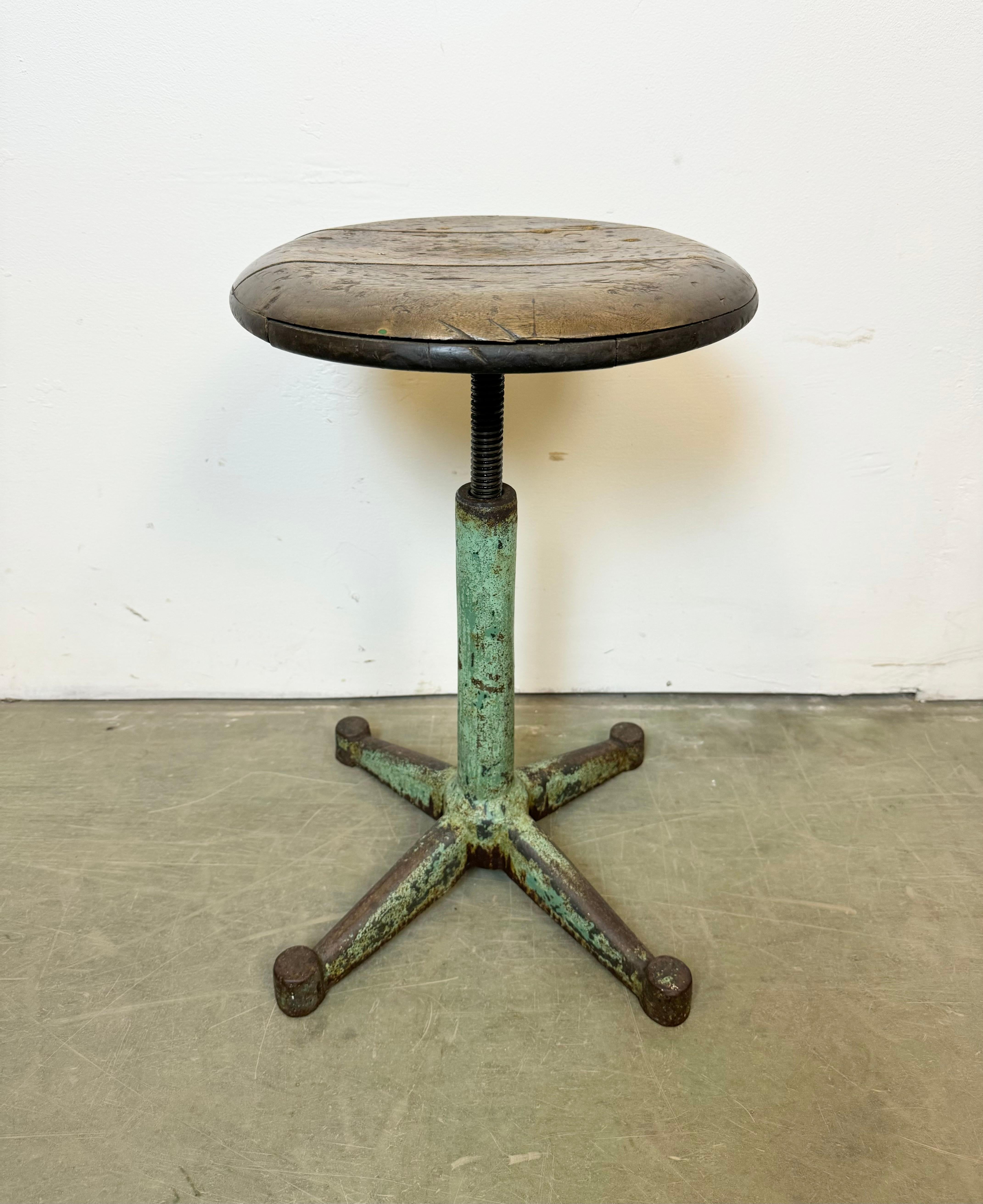 Industrial four-legged height adjustable workshop stool made in Poland during the 1960s.It features a green cast iron base and a wooden seat.
Measures: Min.- Max. seat height: 43 cm - 68 cm.
Seat diameter: 34 cm.
Weight: 6 kg