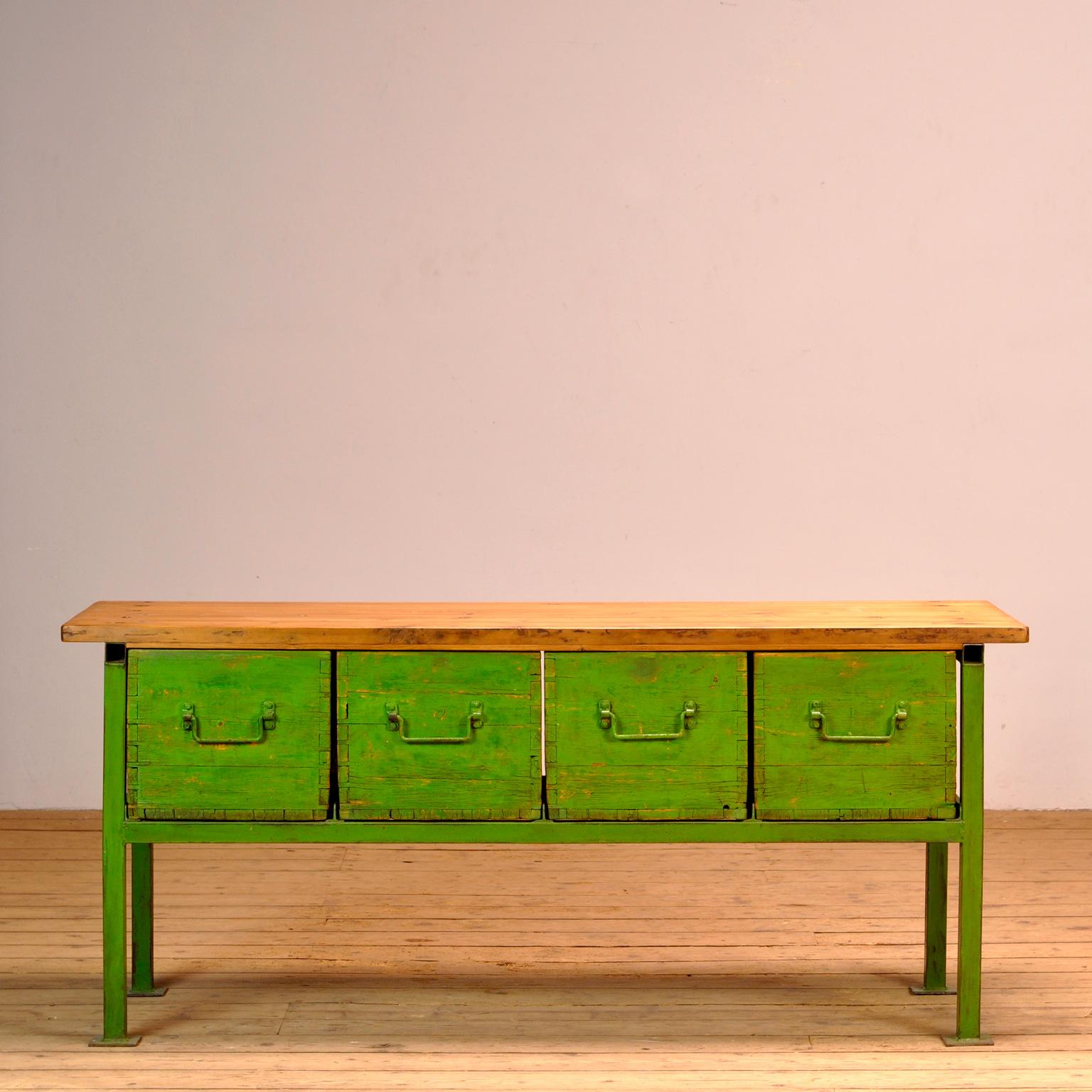 Nice large industrial workbench. The workbench is made of iron with 4 drawers of wood. In the 4 drawers, made of solid pine with dovetail connections, a lot of storage space. Can be used, for example, as a sideboard or as a kitchen island or counter.