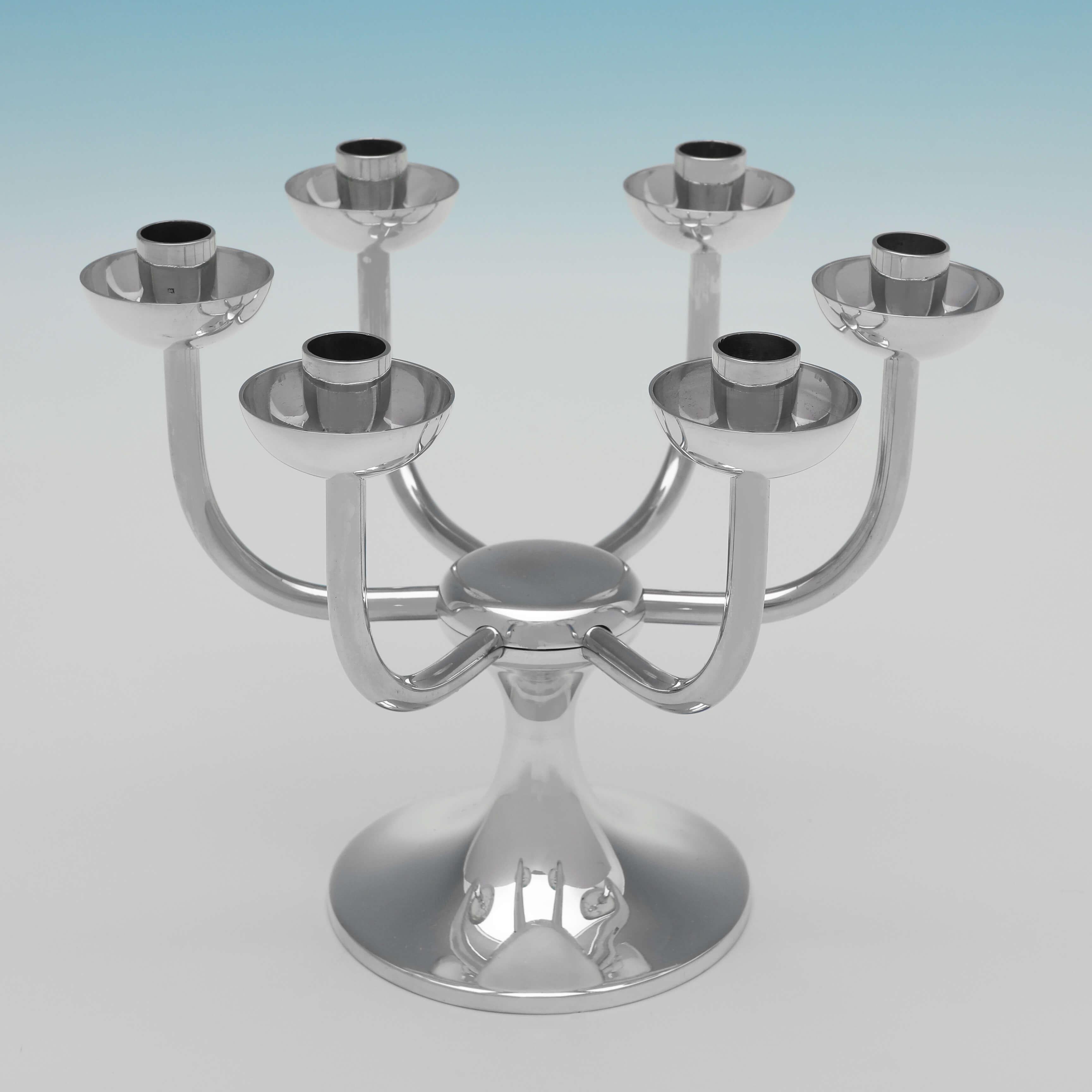 Hallmarked in Birmingham in 1973 by Robert Welch, this stylish, Sterling Silver Candelabrum, will hold 6 candles, and is in the Industrialist style Welch became famous for. The candelabrum measures 5.25