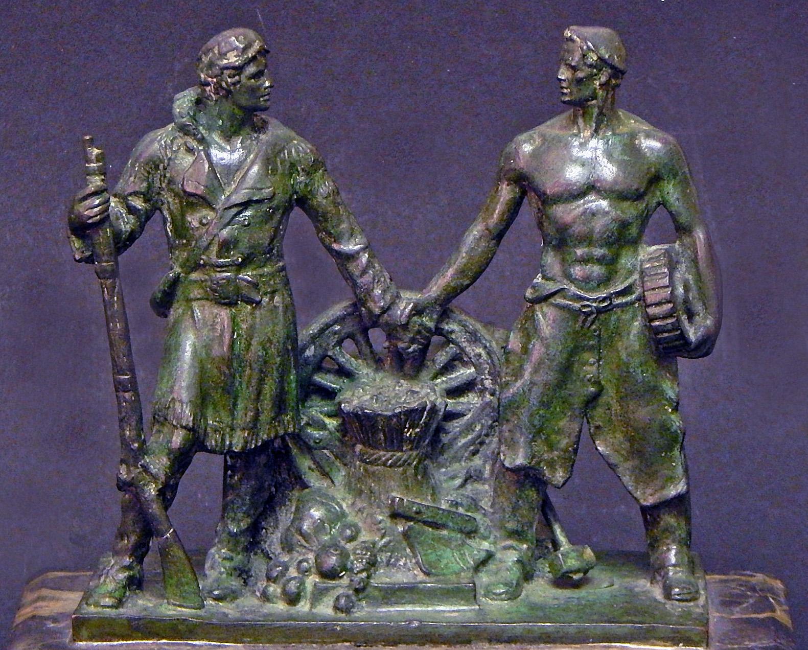 This very fine and rare sculpture depicts two brawny figures -- one a half-nude worker with a gear in his hand, and the other a buckskin-clothed Pioneer with a rifle in his hand and an abundance of produce at his feet -- reaching out to clasp hands