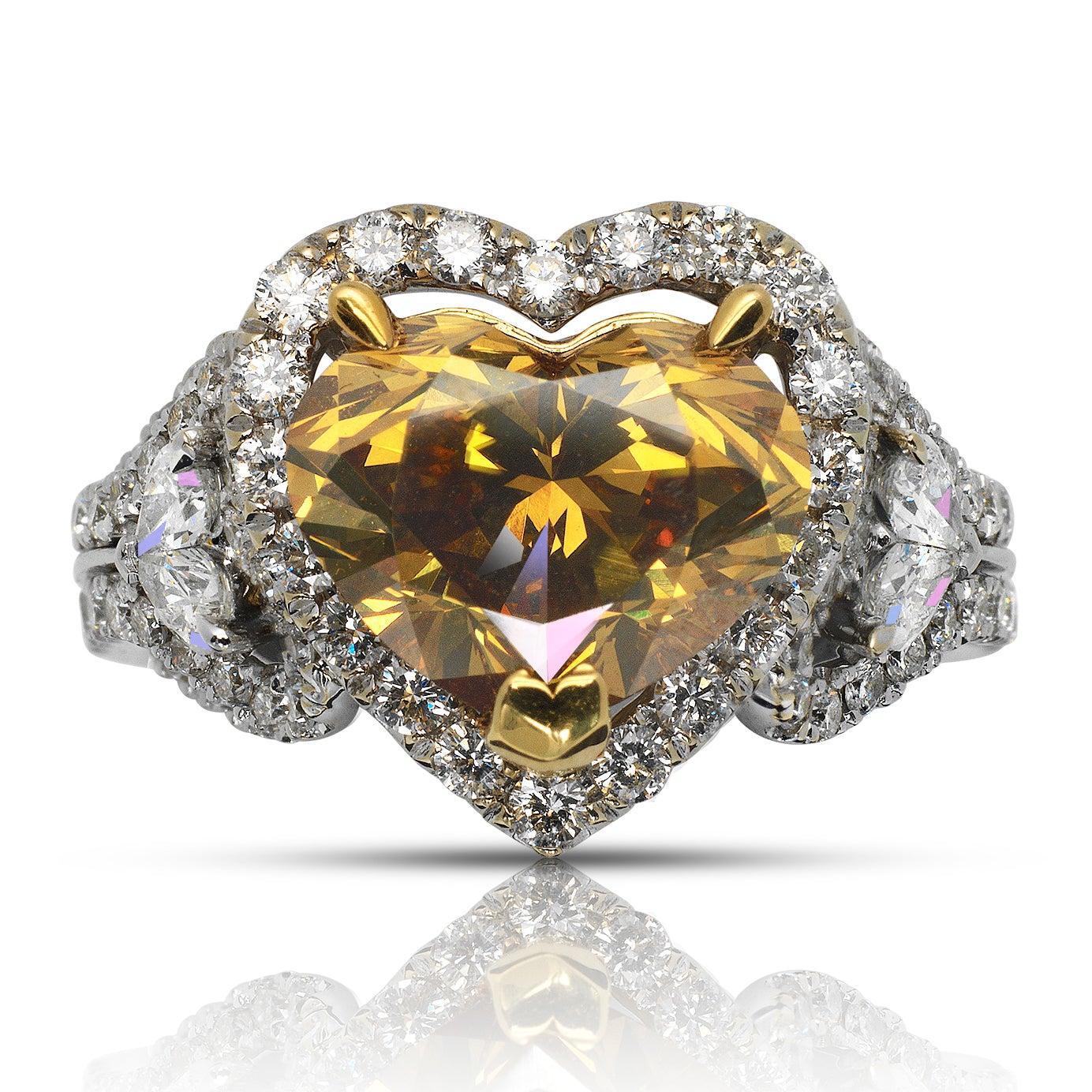 INDY HALO HEART SHAPE FANCY DEEP ORANGY YELLOW DIAMOND ENGAGEMENT RING BY MIKE NEKTA


Center Diamond:

Grading Report: EGL USA 
Carat Weight : 3.19 Carats
Color Grade:   Fancy Deep Orange Yellow  
Clarity: VS1 

Distribution : EVEN
Comments:
