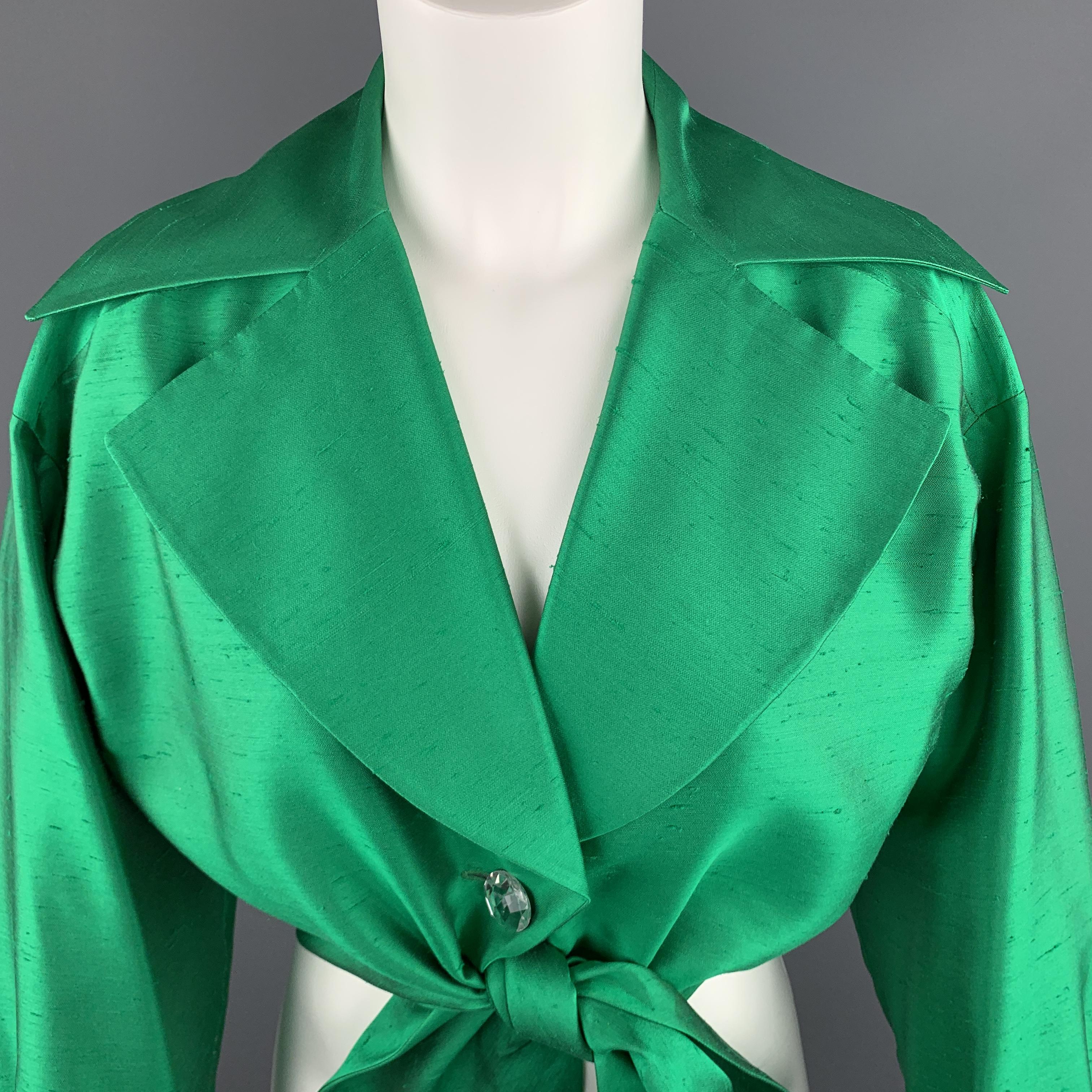 Vintage INES de la FRESSANGE dress top comes in vibrant emerald jewel green silk Shantung with a wide pointed collar lapel, clear rhinestone buttons, and cropped tie front. Made in France.

Excellent Pre-Owned Condition.
Marked: FR
