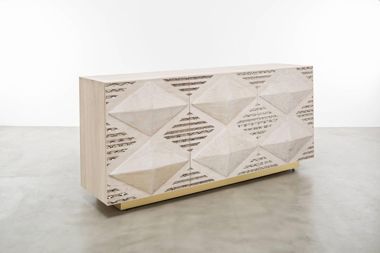 Handbags inspired the Ines Snake buffet cabinet from the late 1970' featuring a bleached oak body with hand-carved oak diamond details and genuine python skin inlay. Our plinth base has a brushed brass finish. This is a 50% Final Payment.