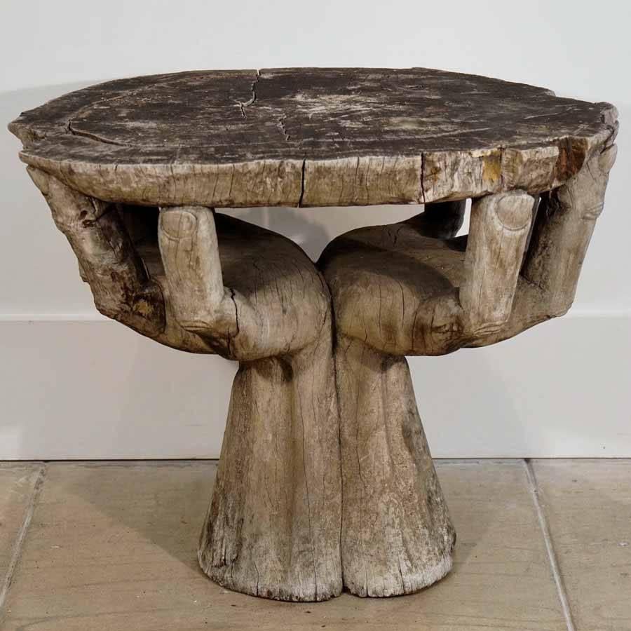 1960s hand cocktail table.
Hand-carved petrified redwood pair of cupped hands supporting an organic shaped cocktail table top.


 
