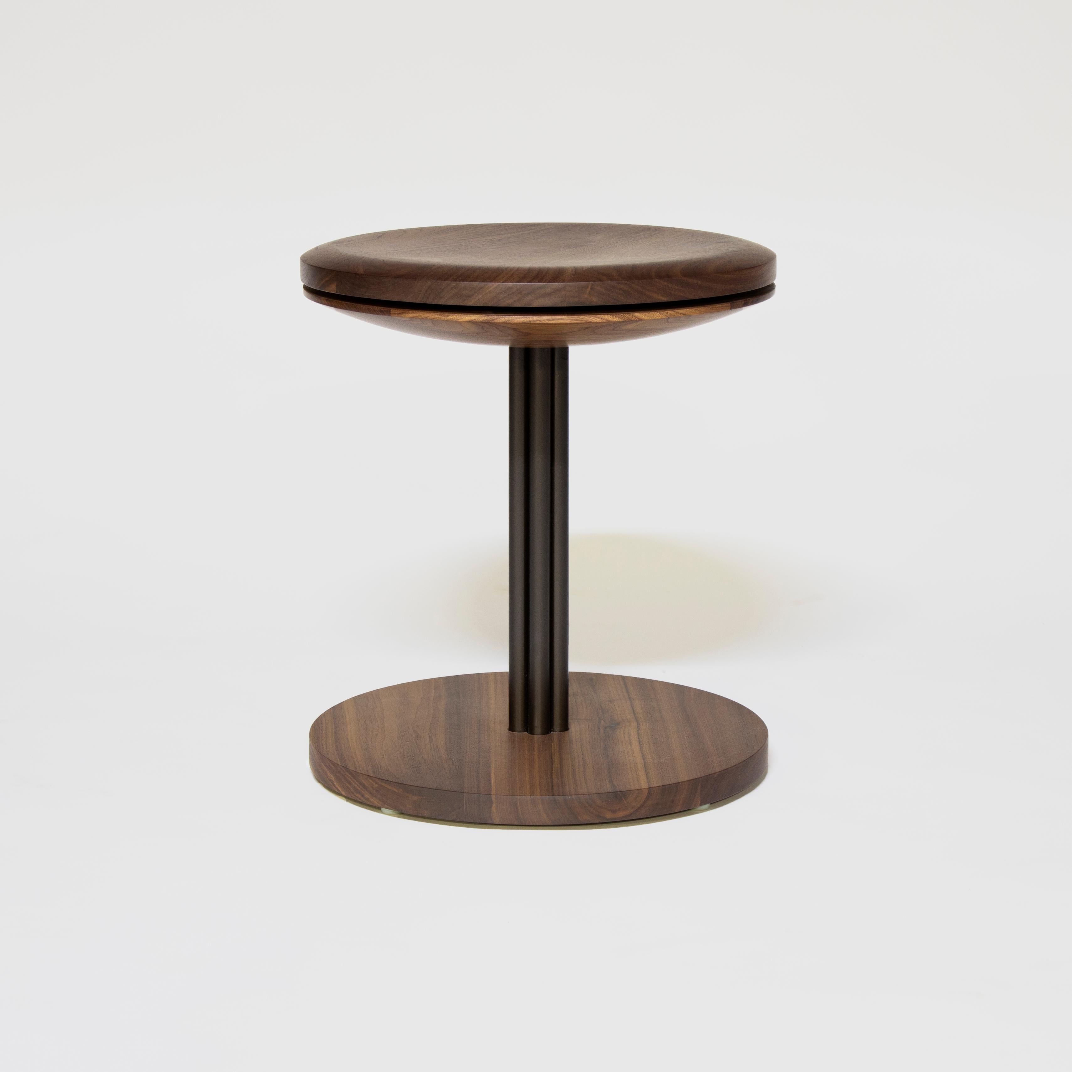 Inez stool
by Crump and Kwash 

Carved solid wood seat and base / hand rubbed zero VOC oil finish / solid steel construction / 360 degree rotating seat top. 

Measures: Height 18in 
Diameter 16in. 

Wood options: Maple, blackened oak, walnut, white