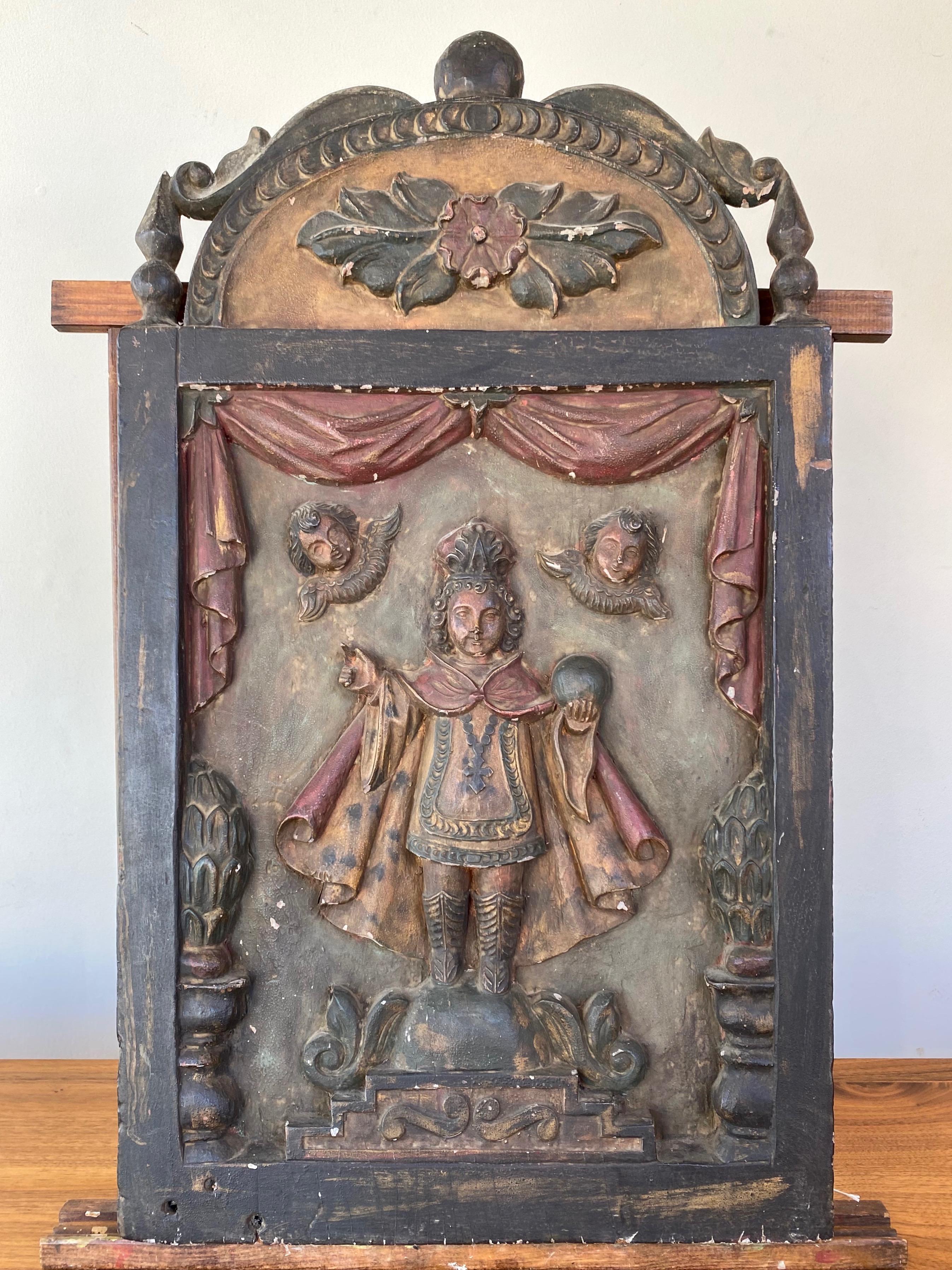 A rare and impressive Italian early 19th century Infant Jesus of Prague or Child Jesus of Prague hand carved and painted solid wood plaque or panel.

Very well-executed and substantial deep relief interpretation of an important work of Roman