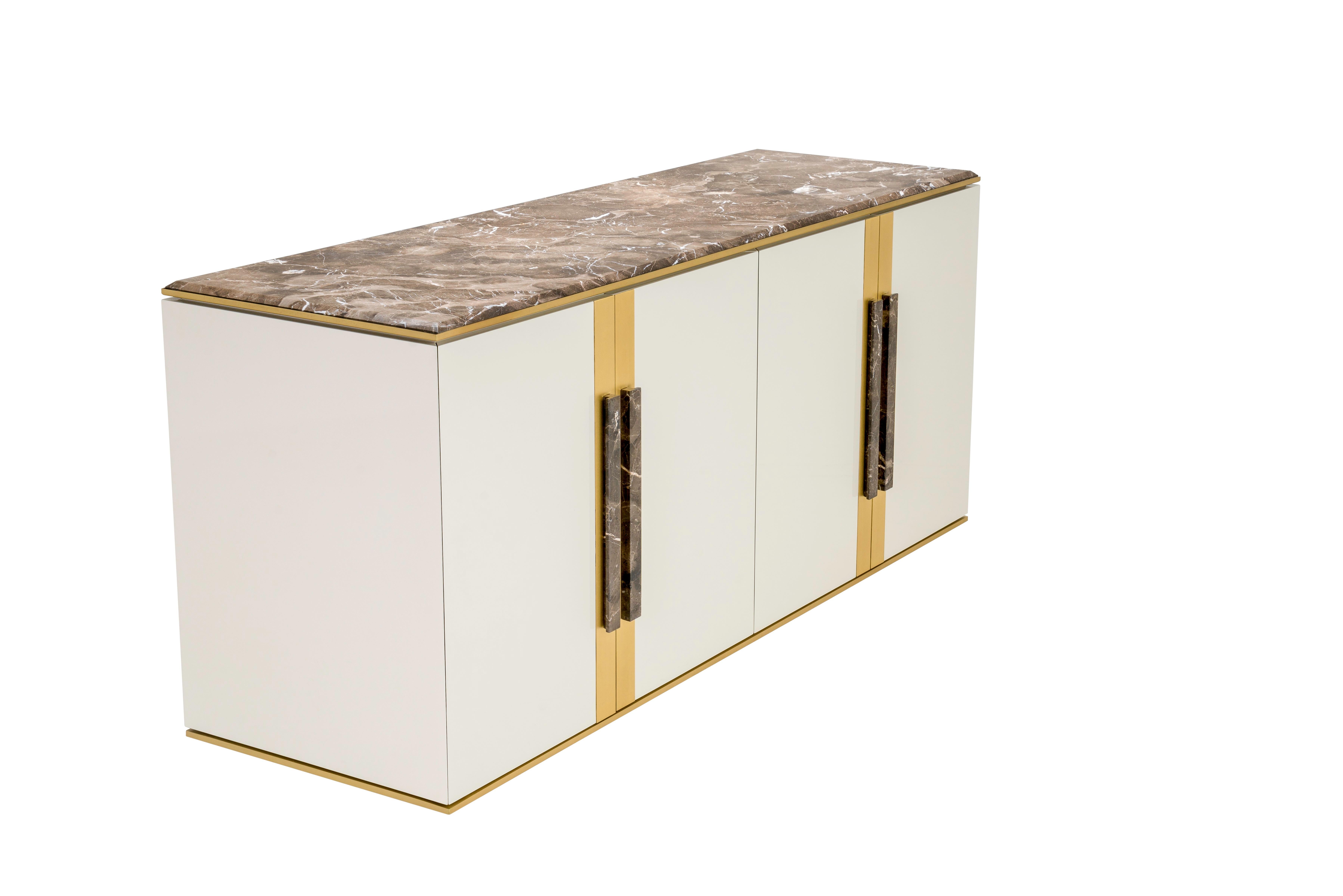 Intemporal and balanced, this sideboard is a decoration must. Natural stone and metal touches embrace the refinment of this piece.

Shown in glossy lacquered structure in CM3 colour with Marron Emperador marble top and handles and brushed brass