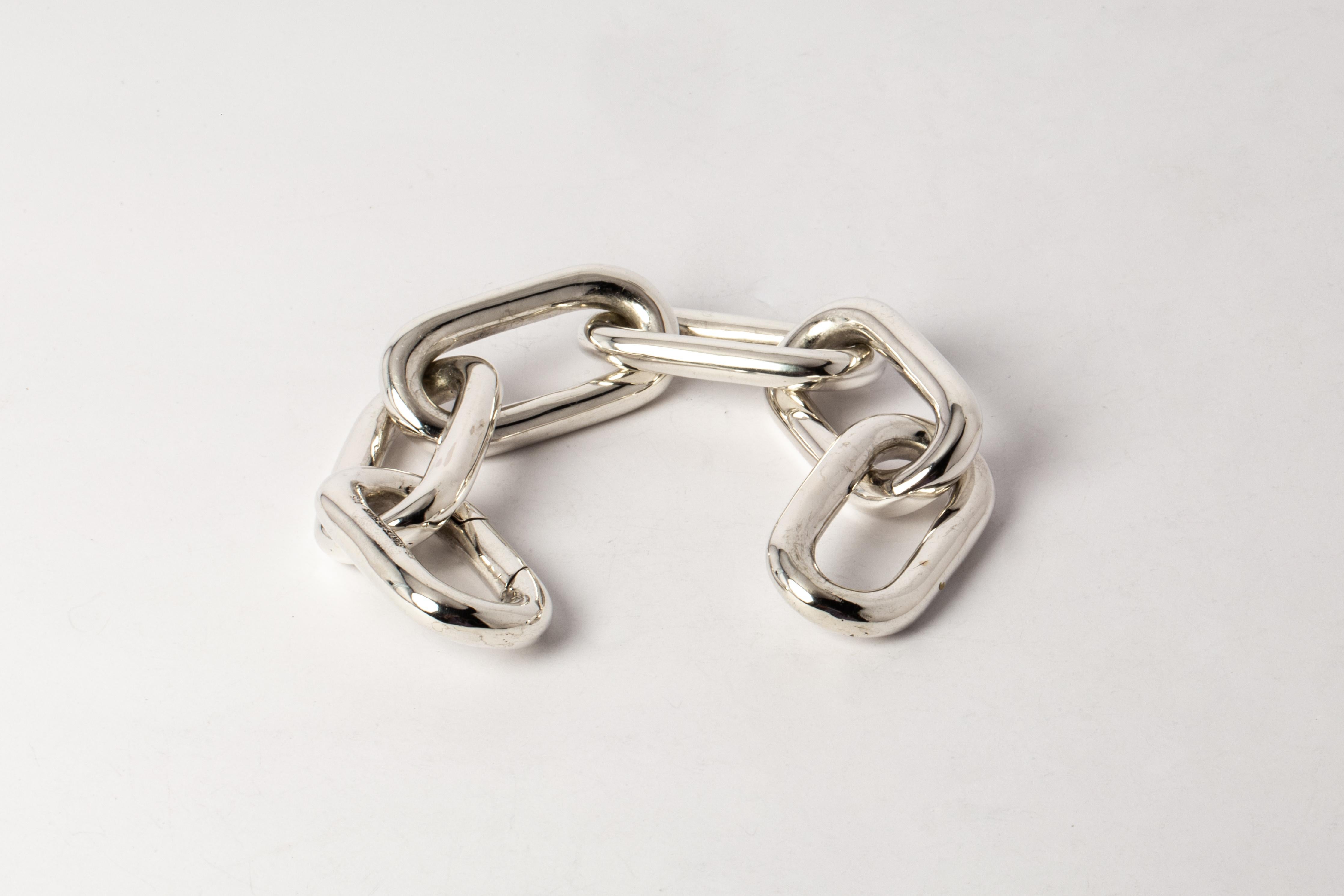 Bracelet in polished sterling silver. This piece is 100% hand fabricated from metal plate; cut into sections and soldered together to make the hollow three dimensional form. 