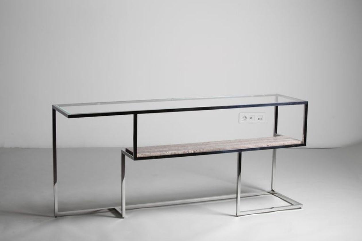 From the Infinity Line, to complete the unique design and transparency of the coffee table.
The Infinity Console or Back-sofa with Extra Clear Glass Top, Grey Travertino Marble antique finish and polished stainless steel.
By Georges Amatoury Studio,