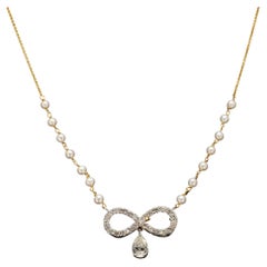 Solitaire Infinity natural diamonds and gold pendant with pearls