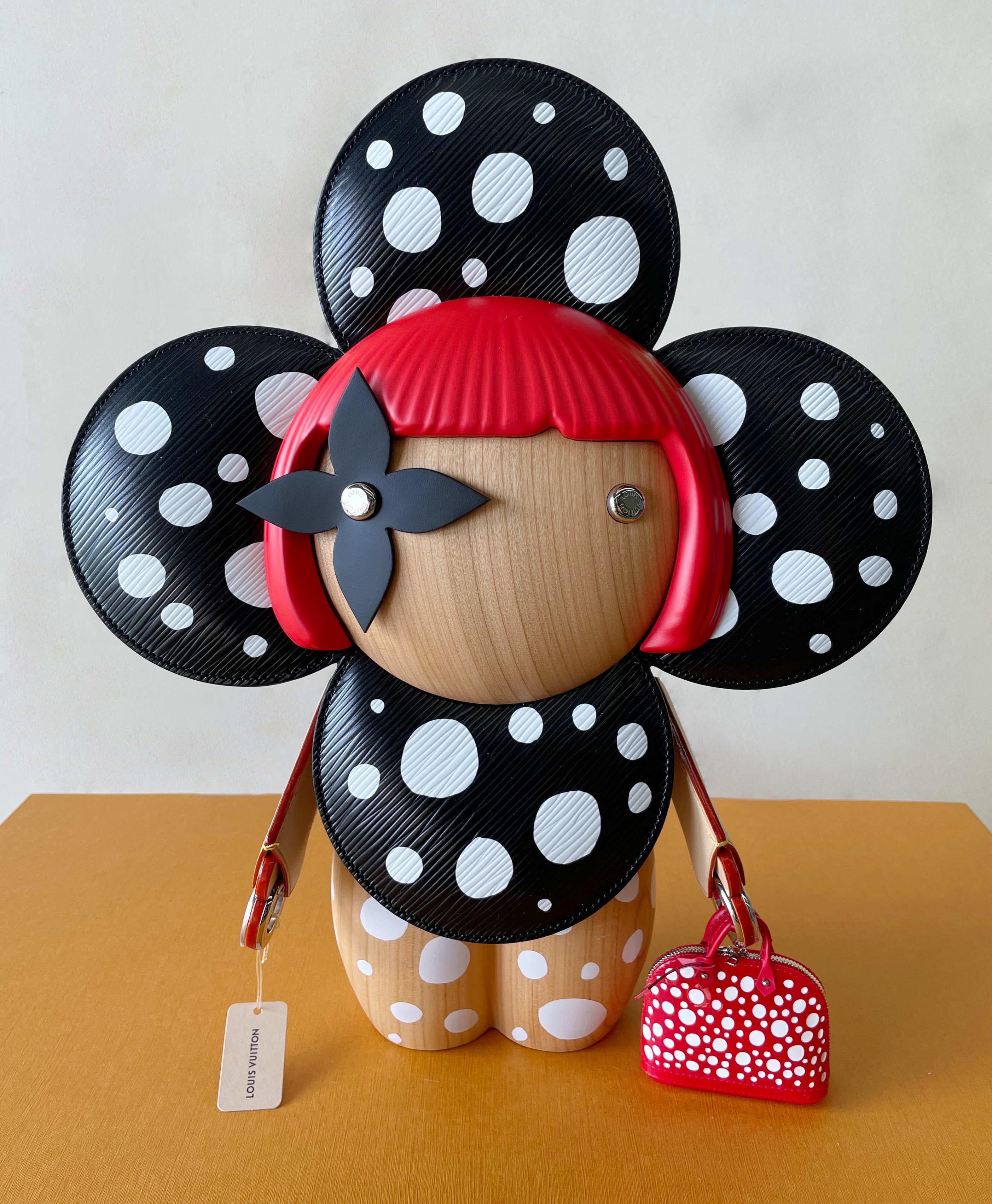 Louis Vuitton's Vivienne mascot dressed up as the iconic Japanese artist Yayoi Kusama on this exquisitely crafted piece in wood with Epi leather, resin, and metal details. The artist's famous recurring dots create a vibrant signature, right down to