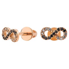 Infinity earrings studs in 14k gold.