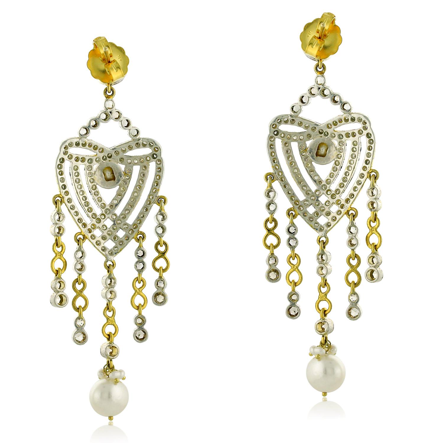 The infinity symbol is often associated with eternal love, while the heart shape is a universal symbol of love and affection. These earrings feature a mix of precious materials, including gold and silver, which adds to their appeal. The pearls and