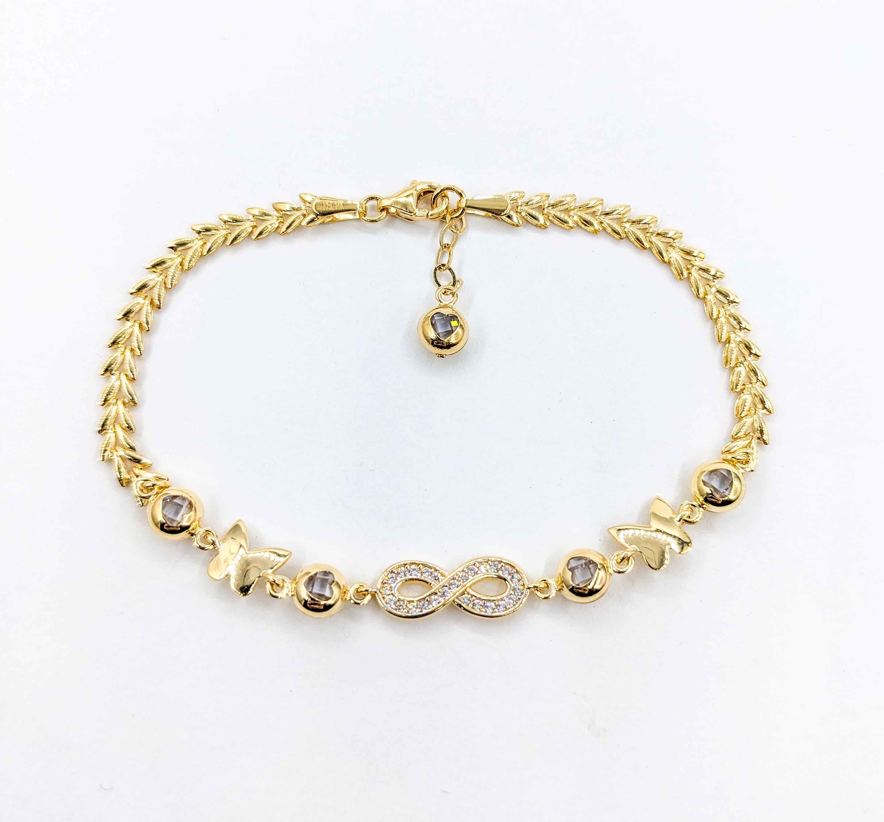 Infinity, Hearts & Butterflies CZ Stone Bracelet In Yellow Gold

Indulge in the allure of this exquisite 14kt Yellow Gold Bracelet featuring dazzling Synthetic Stones with impeccable clarity and a radiant white sparkle. This piece also includes