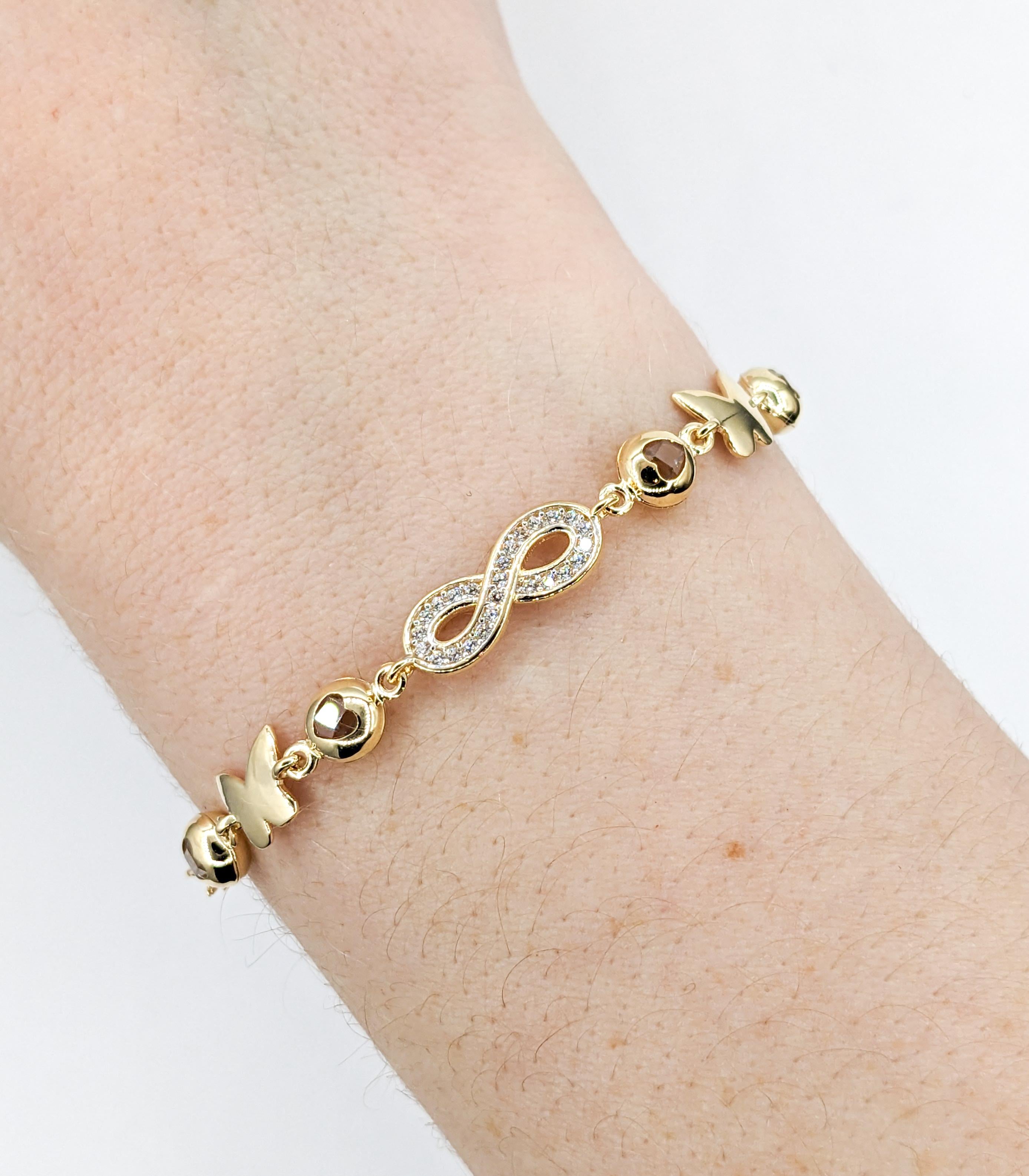 Contemporary Infinity, Hearts & Butterflies CZ Stone Bracelet In Yellow Gold For Sale