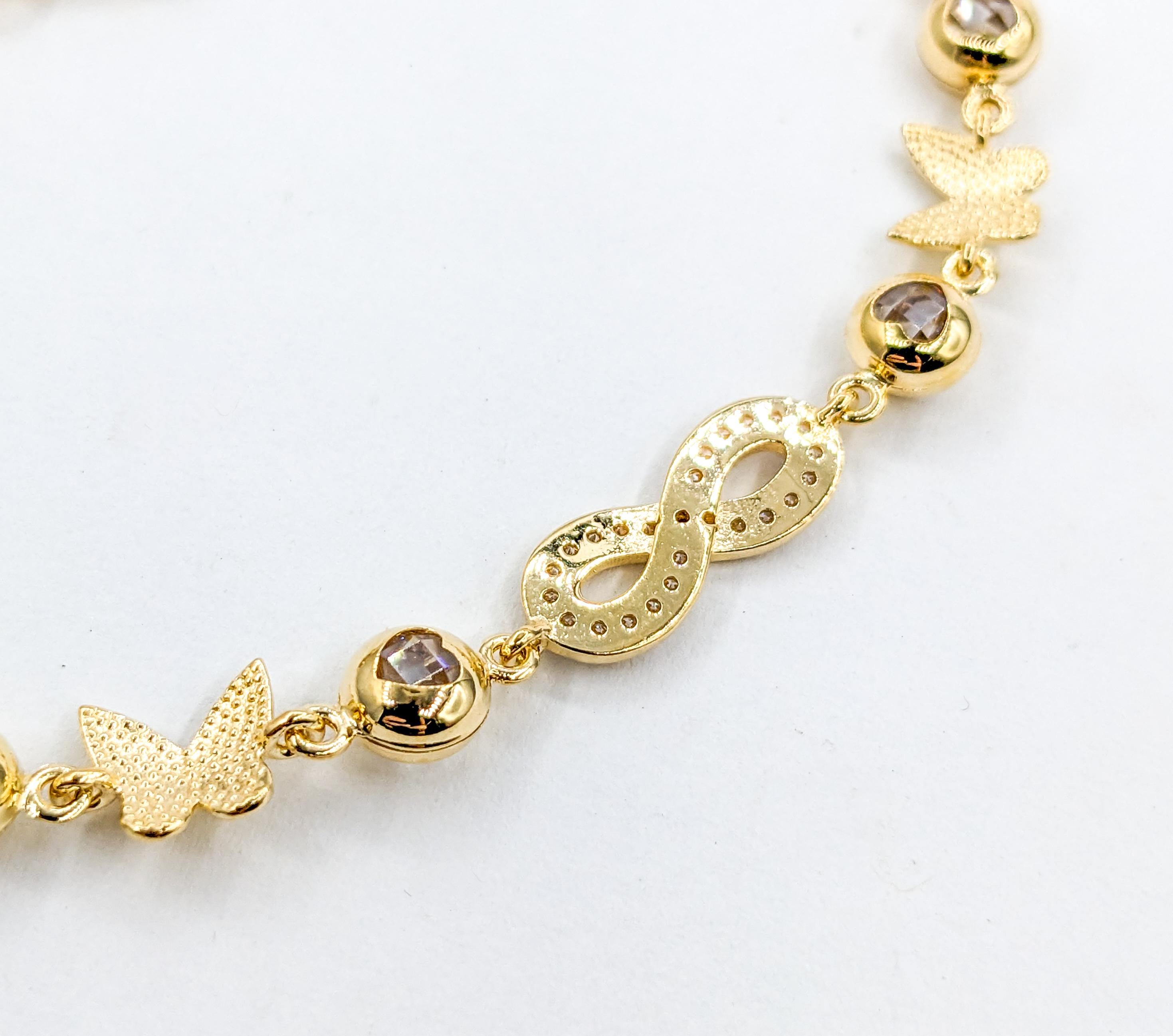 Infinity, Hearts & Butterflies CZ Stone Bracelet In Yellow Gold In Excellent Condition For Sale In Bloomington, MN