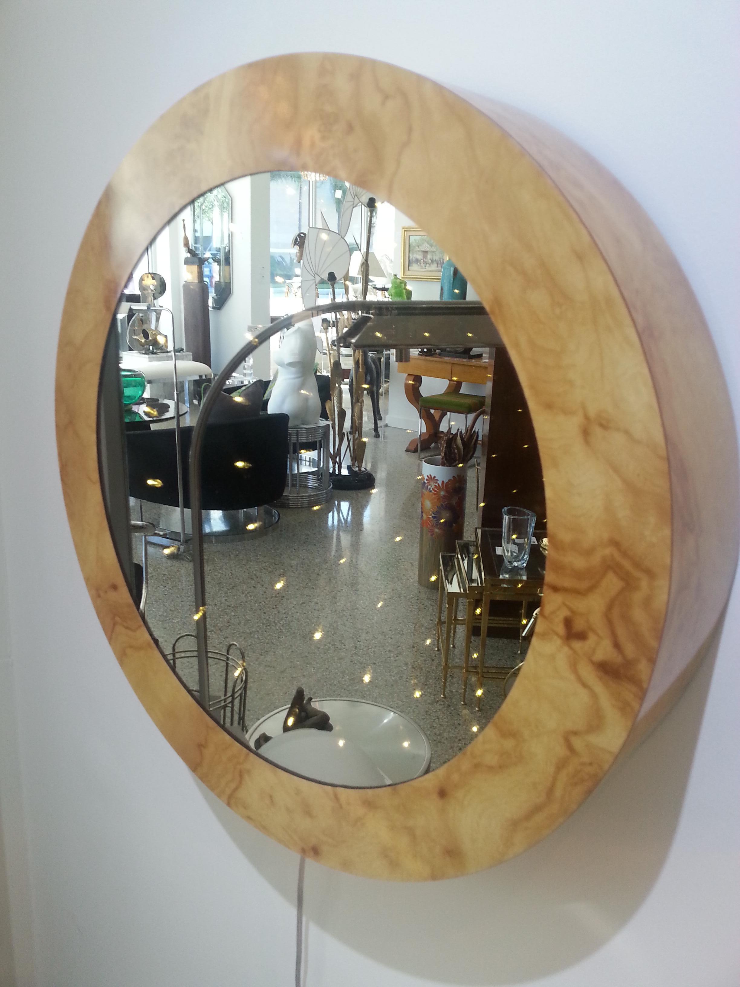 This stylish and hip infinity light mirror was acquired from an estate in South Beach, Florida and dates to the 1970s. The frame is a burl pattern laminate and the mirror a bronze coloration.

Note: There is a line switch on the cord.