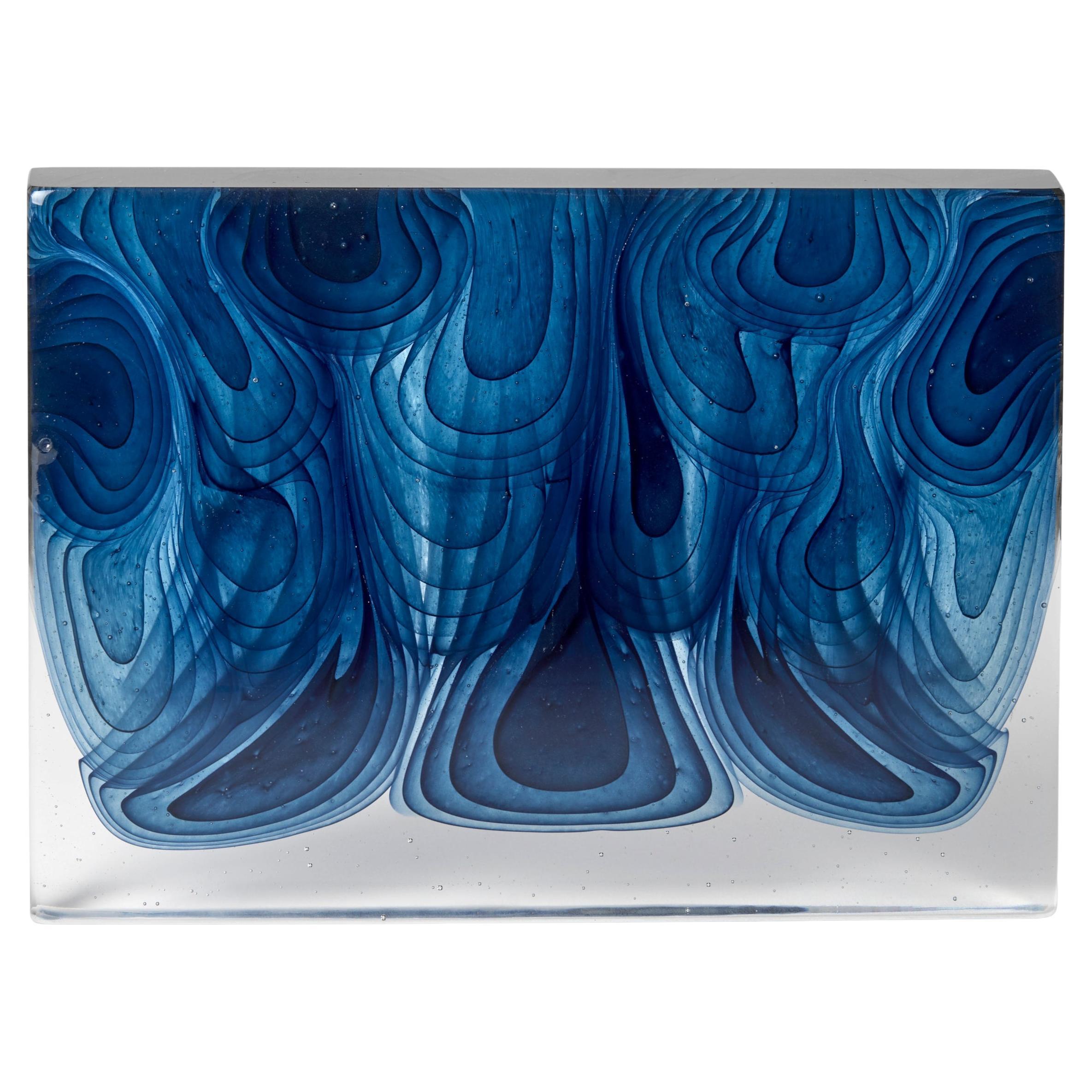 Infusion, an abstract fluid blue 
clear cast glass sculpture by Helen Restorick