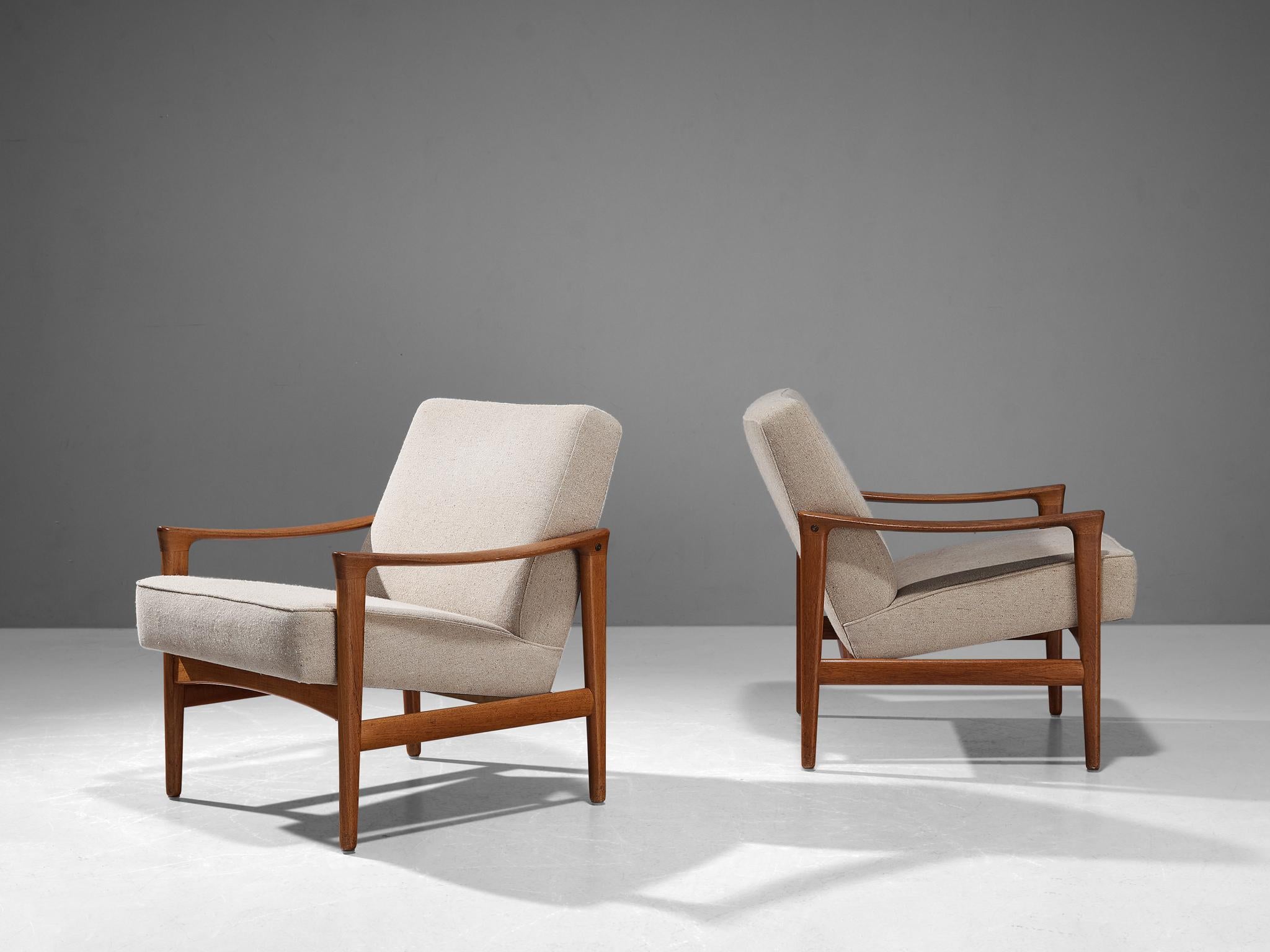 Inge Andersson for Bröderna Andersson, pair of lounge chairs, model 'Oslo', teak, fabric, Sweden, 1960s

These armchairs are a prime example of Scandinavian Mid-Century design ideology. Clear in its appearance, use of neutral materials, and refined