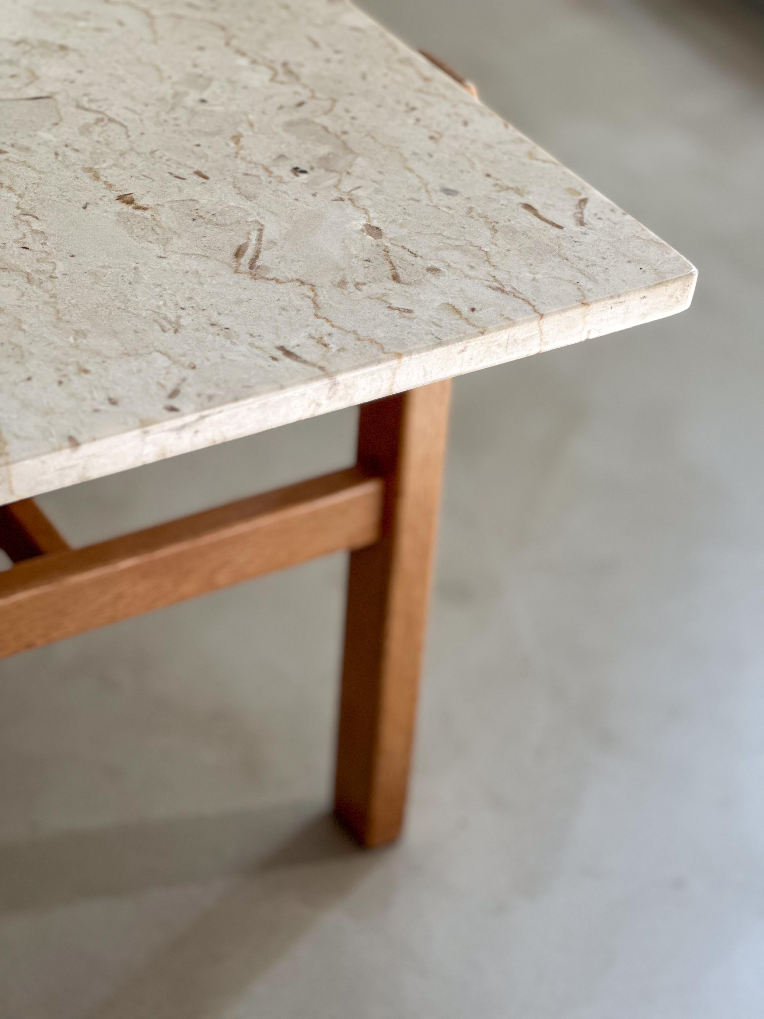 Oak and marble coffee table designed by Swedish furniture designer Inge Davidson and crafted by cabinetmaker Ernst Johansson, Långås, Sweden. The model was launched in 1964 and was produced in different combinations of wood and stone as well as