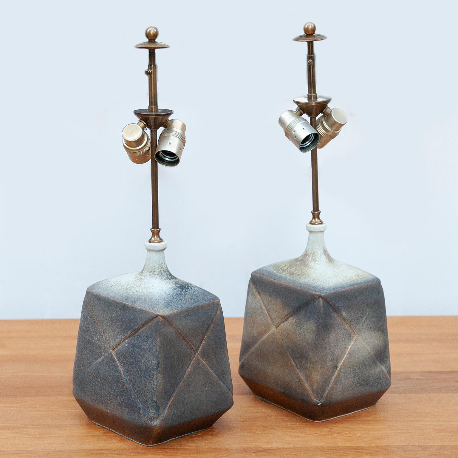 Unique sculptural stoneware table lamps in cubic shape with semi gloss glazed dark mud-colored optics. Impressed monogram on the side.

 