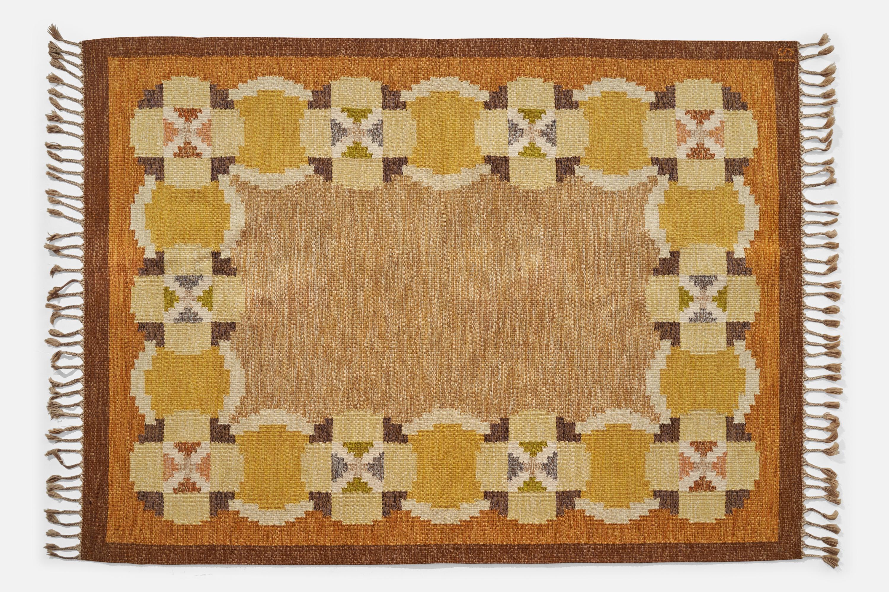 An orange, brown and yellow-dyed flatweave wool carpet designed and produced by Ingegerd Silow, Sweden, c. 1950s.