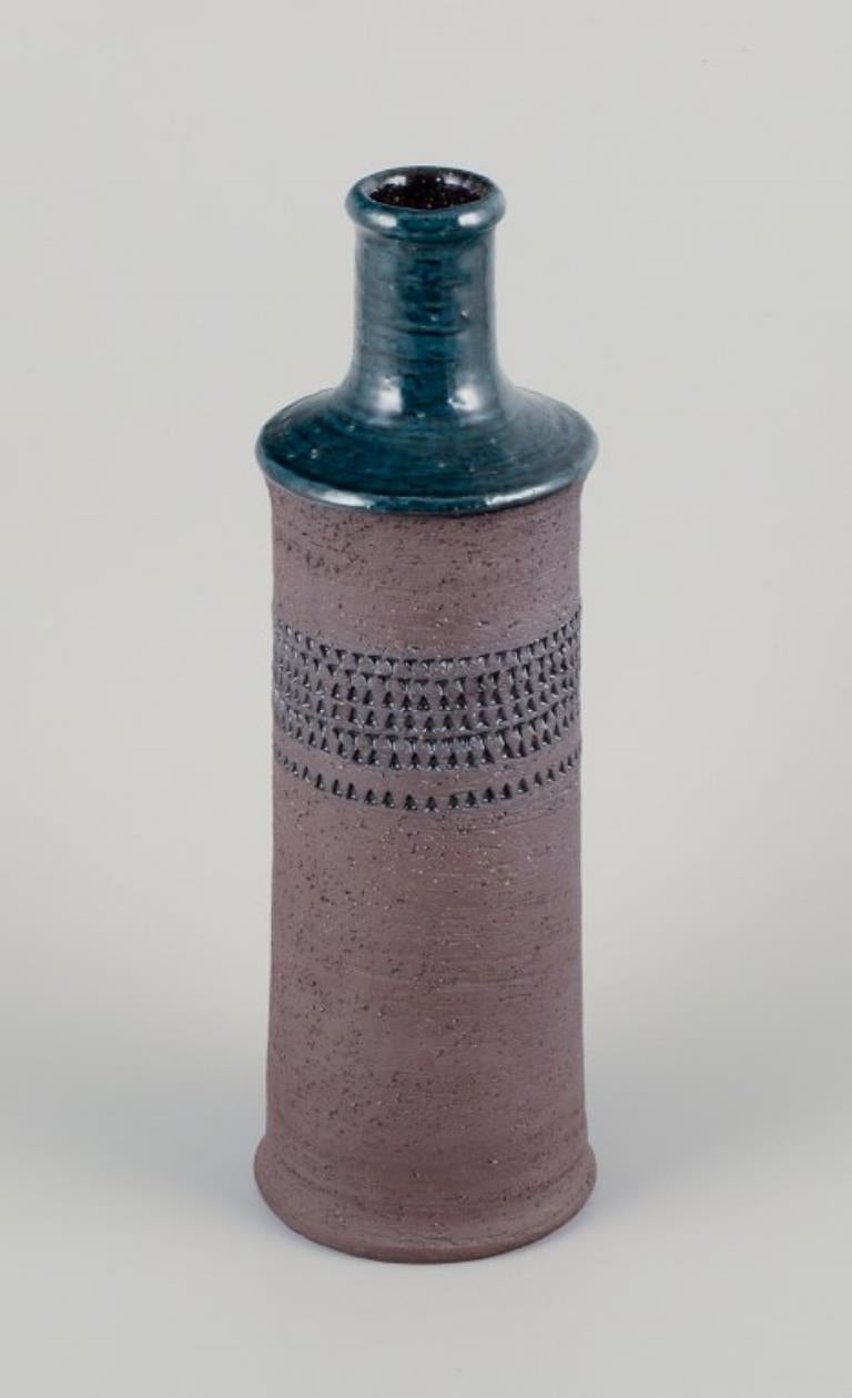 Inger Persson for Rörstrand Atelje, Sweden.
Large ceramic vase, partly unglazed with petrol blue glaze.
1960s.
Marked.
Perfect condition.
Dimensions: H 33.0 cm x D 10.5 cm.