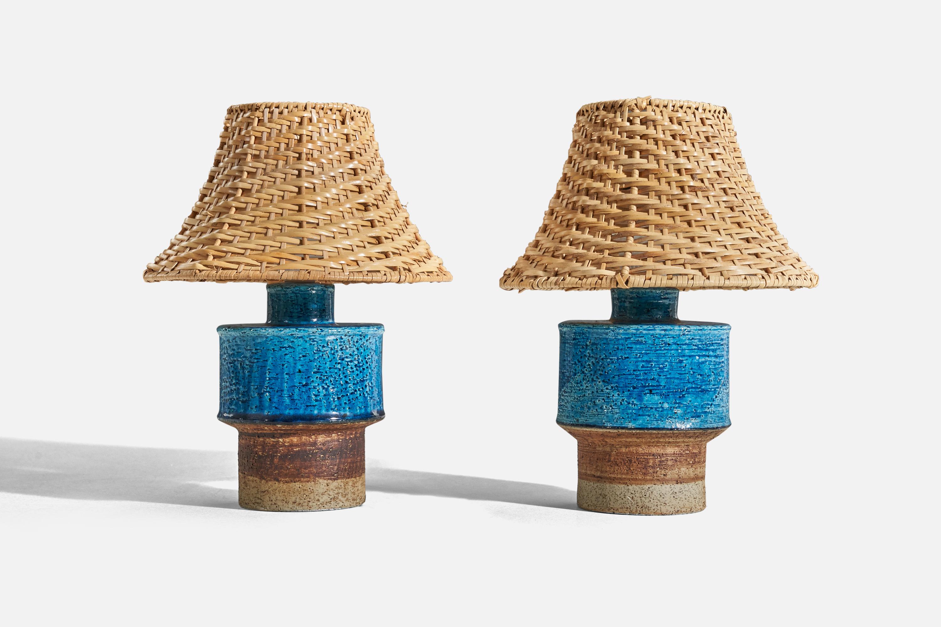 A pair of blue and brown, glazed stoneware table lamp designed by Inger Persson and produced by Rörstrand, Sweden, c. 1960s.

Sold without lampshade. 
Dimensions of Lamp (inches) : 8.4375 x 5 x 5 (H x W x D)
Dimensions of Shade (inches) : 4 x