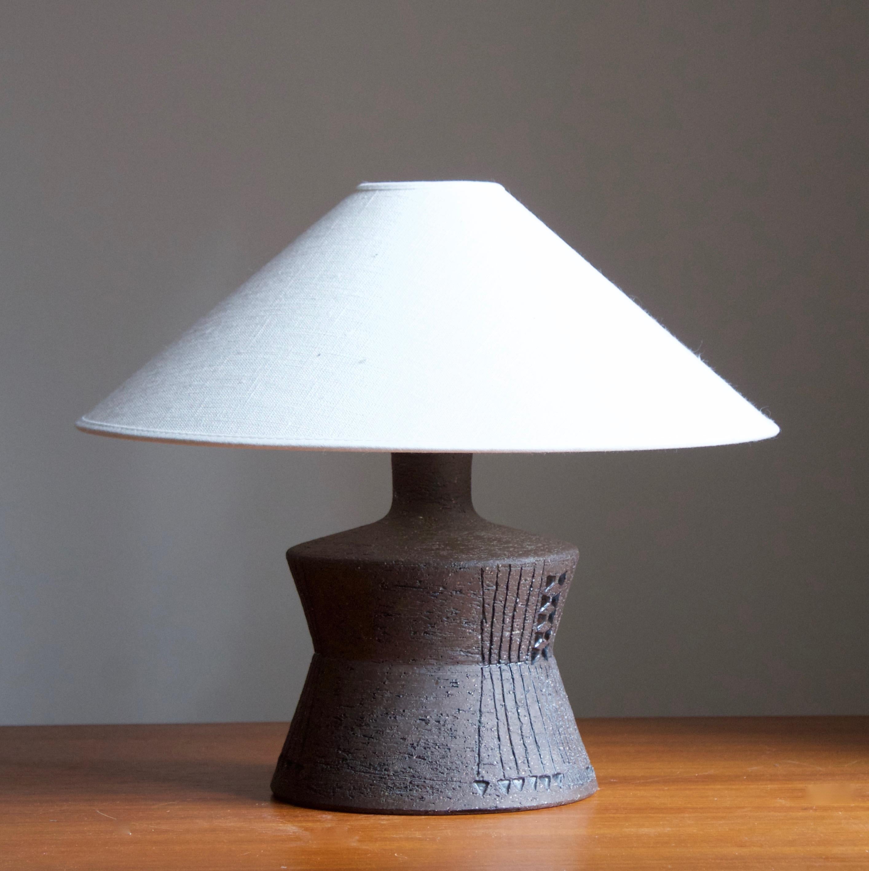 A unique table lamp, designed by Inger Persson for Rörstand, Sweden 1960s. 

From the series known as Atelje-gods, produced in limited number, each example with unique glaze and decor.

Stated dimensions exclude lampshade. Height includes