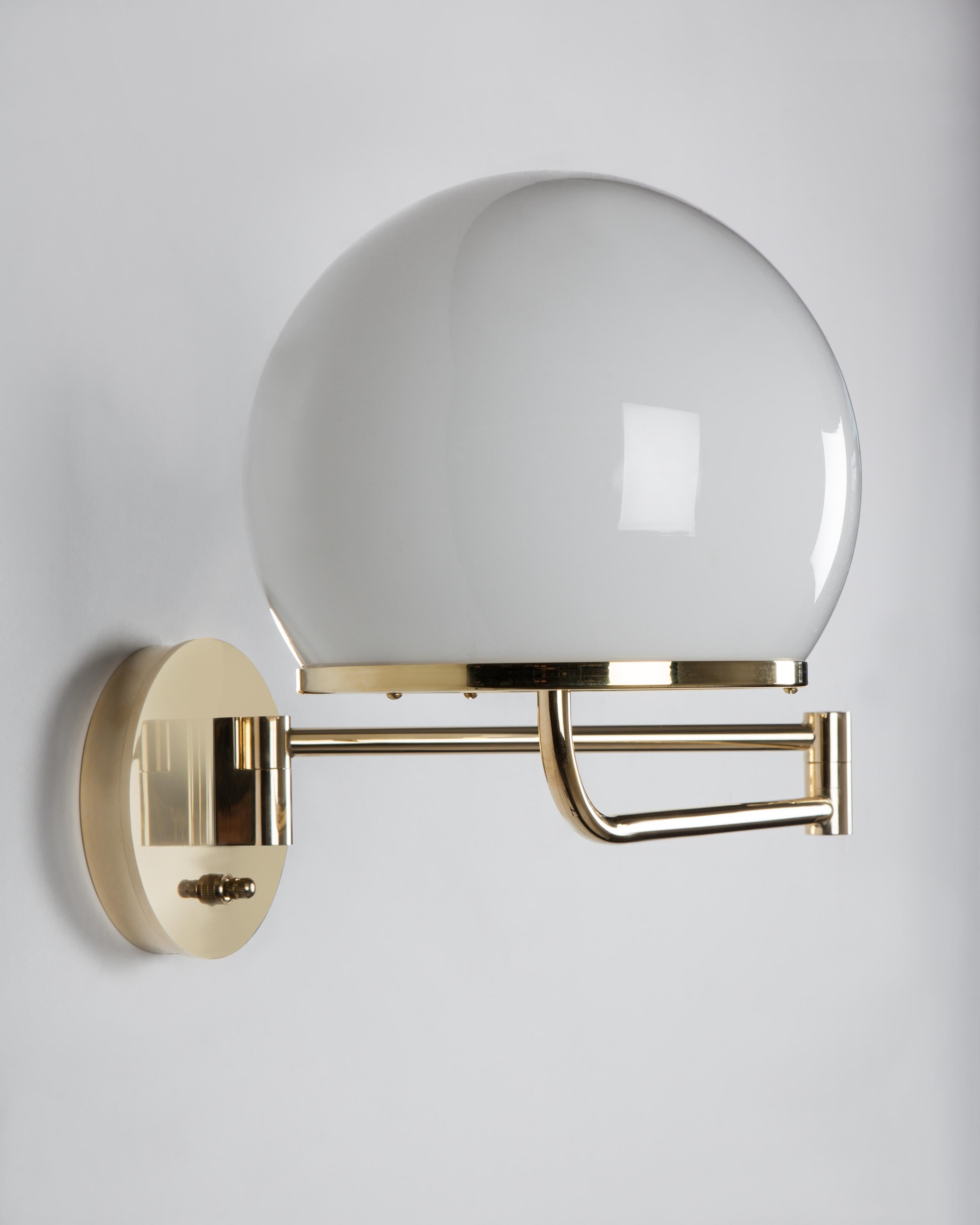 WIS2223.S
The Ingersoll swing-arm sconce by Remains Lighting has a simple yet elegant form with a minimal in-curving ring supporting its almost full-round white milk glass shade. This wall light features a simple swing arm mechanism, adjustable from