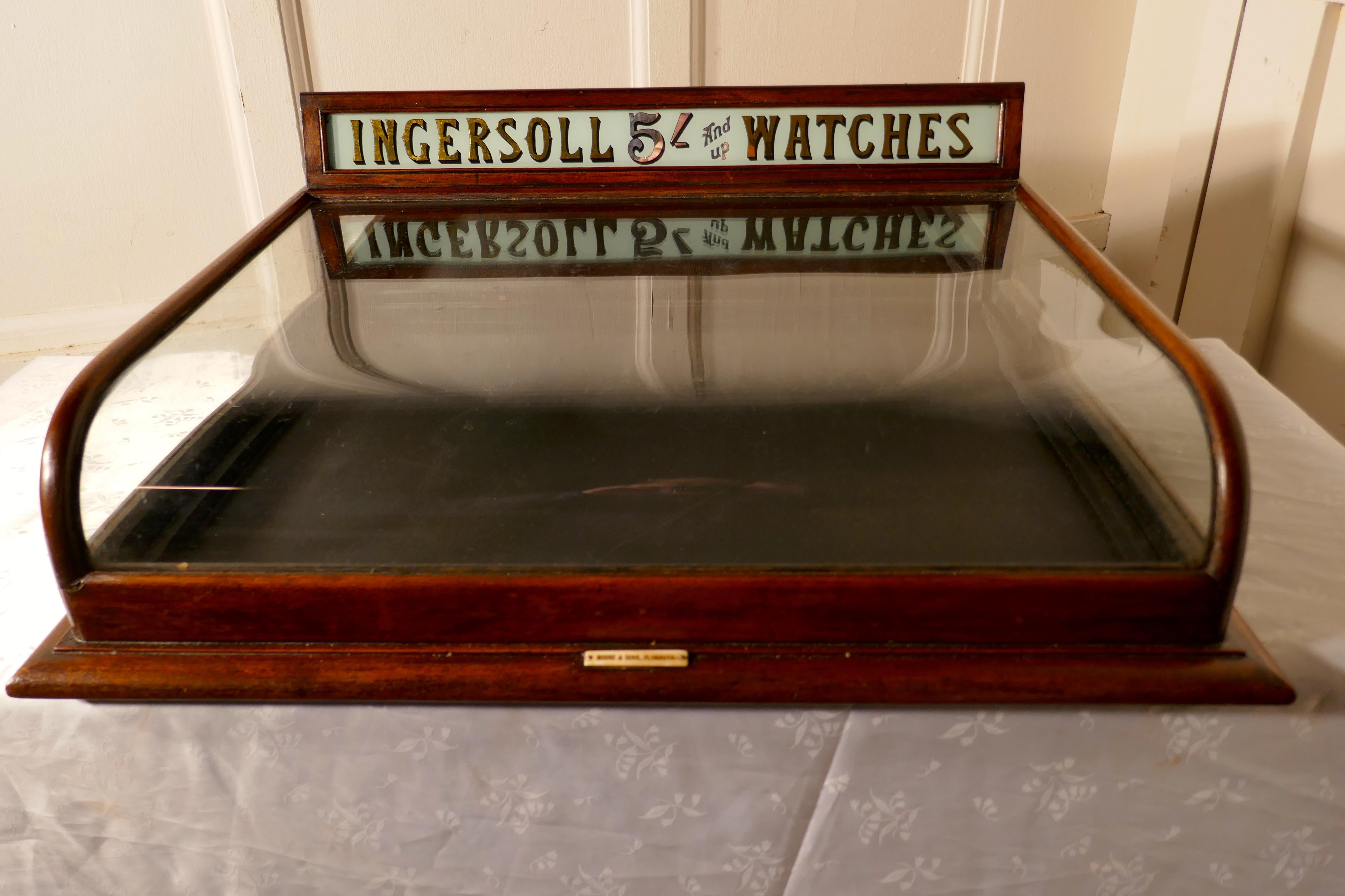 Ingersoll Jewelers shop watch shop display cabinet

This is a very very good piece, it has at the back the Ingersoll advertising sign, this is in Gold shadowed writing on Milk Glass announcing “INGERSOLL 5/- AND UP WATCHES “
The cabinet is a