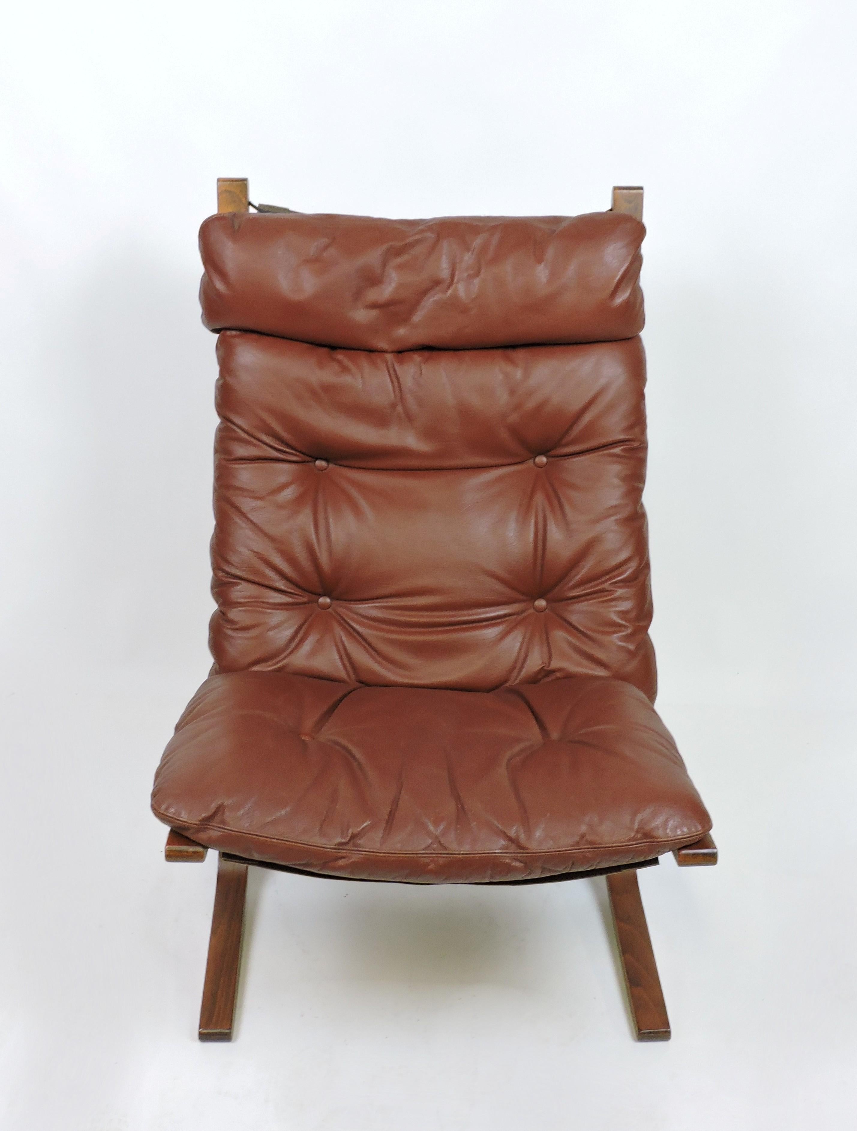 Sleek and sexy Siesta high back lounge chair designed by Ingmar Relling and made in Norway by Westnofa. This award winning chair has a bentwood frame with a leather cushion that sits on a canvas sling. 

About Mr. Relling:
Ingmar Anton Relling