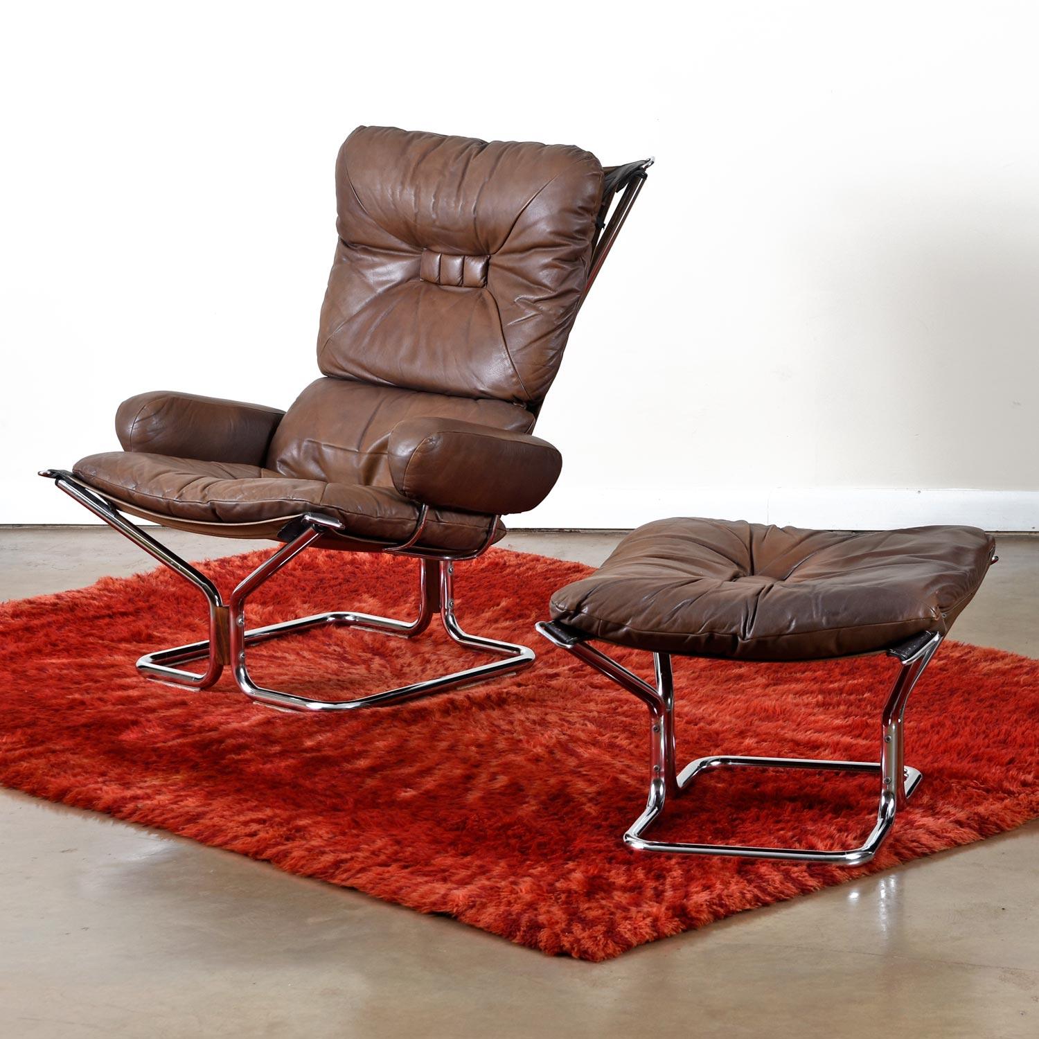 Vintage Ingmar Relling leather lounge chair and ottoman exported to the U.S. market by Westnofa of Norway. Accented with rosewood and decoratively baffle box stitched to showcase an elevated and tailored look to the otherwise minimal, modern design.