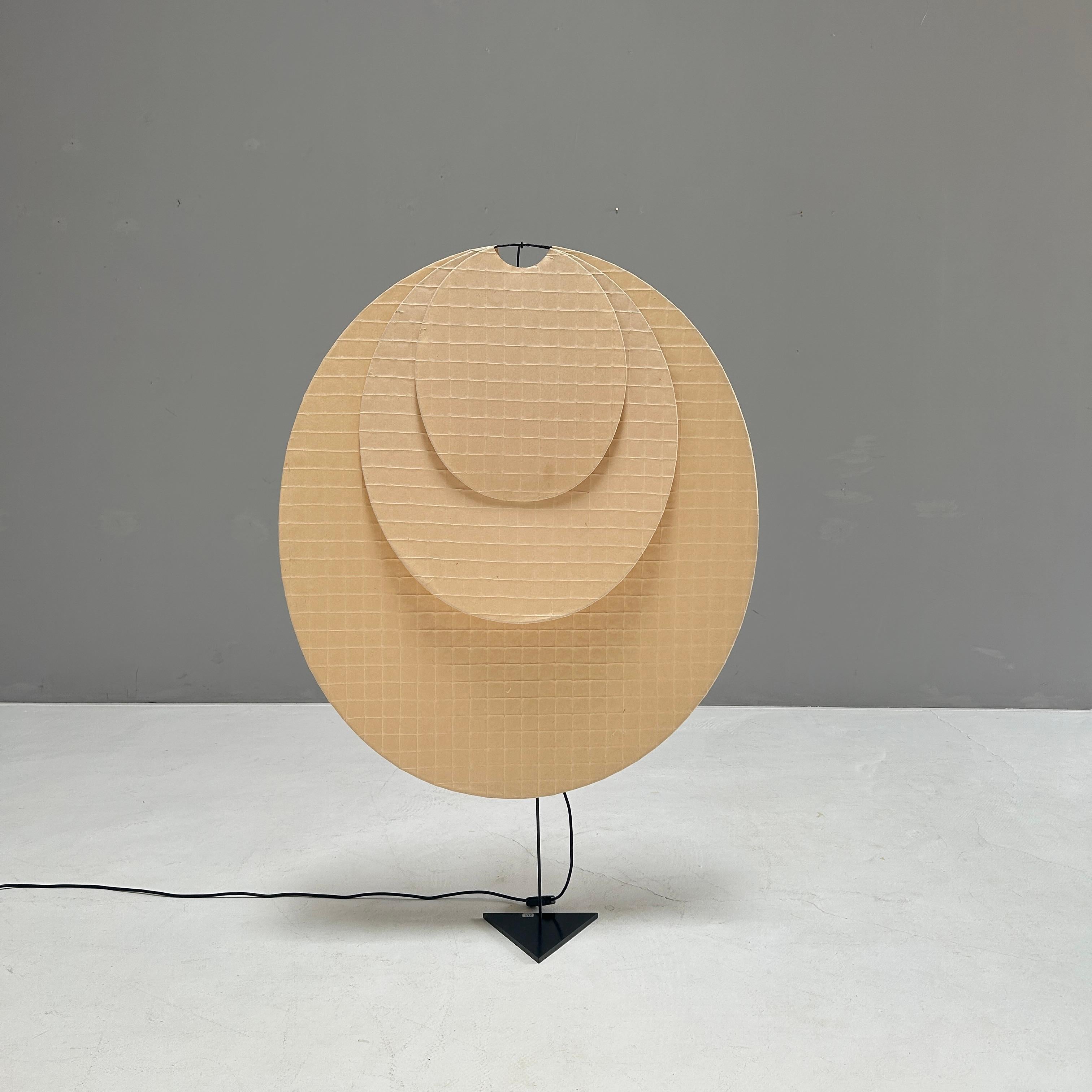 Very rare floor lamp by Ingo Maurer for M Design
 
Three oval metal frames of different sizes are covered with an Ami-Kami net.
The unconnected paper surfaces illuminated from behind create a unique play of colors and light.
 
And in view of this